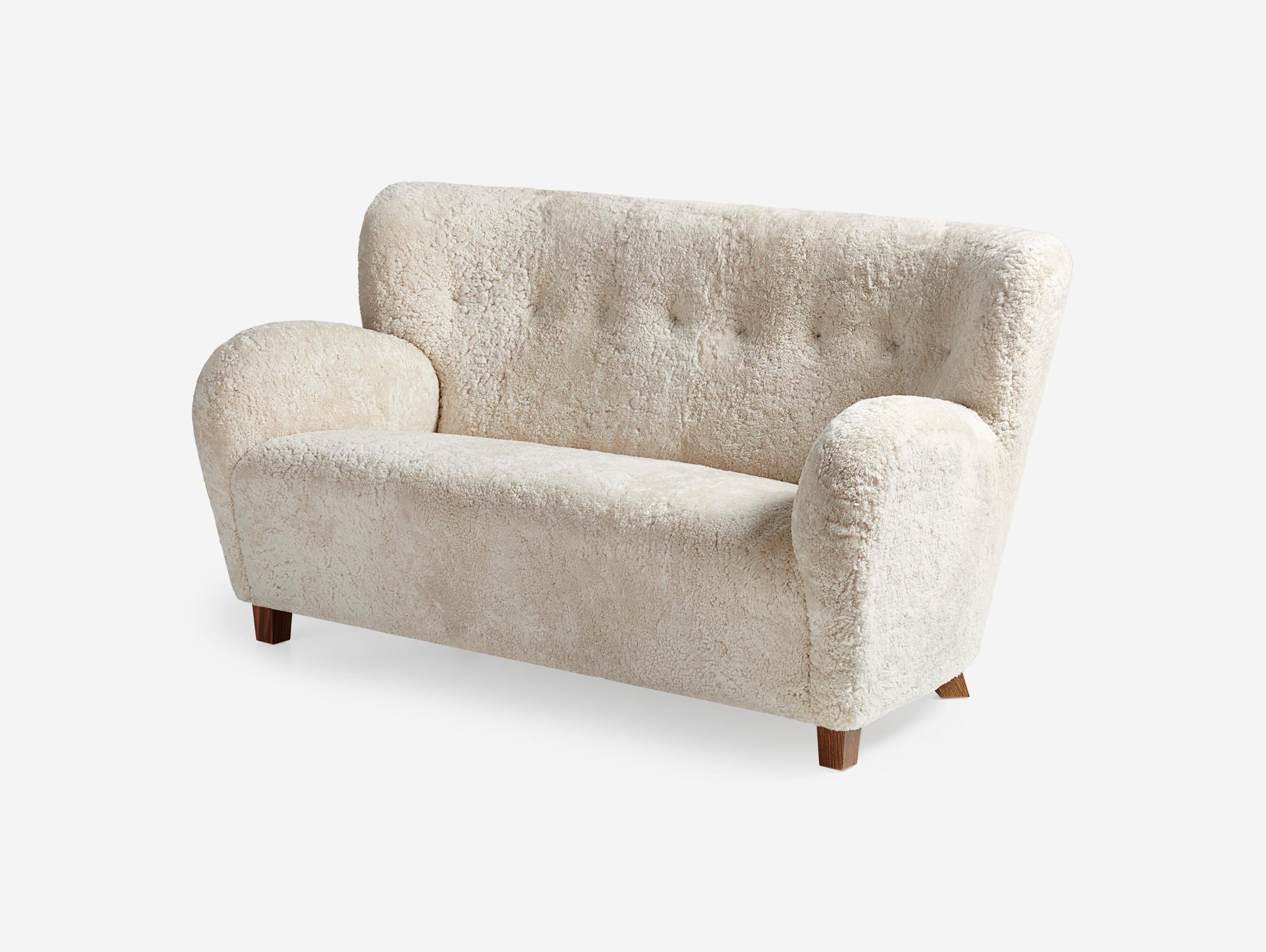 https://a.1stdibscdn.com/custom-made-sheepskin-karu-sofa-by-dagmar-for-sale-picture-5/f_13332/f_431187721736615653389/Dagmar_Karu_Sofa_155W_SK_Moonlight_Walnut_Angle_2_Wide_master.jpg