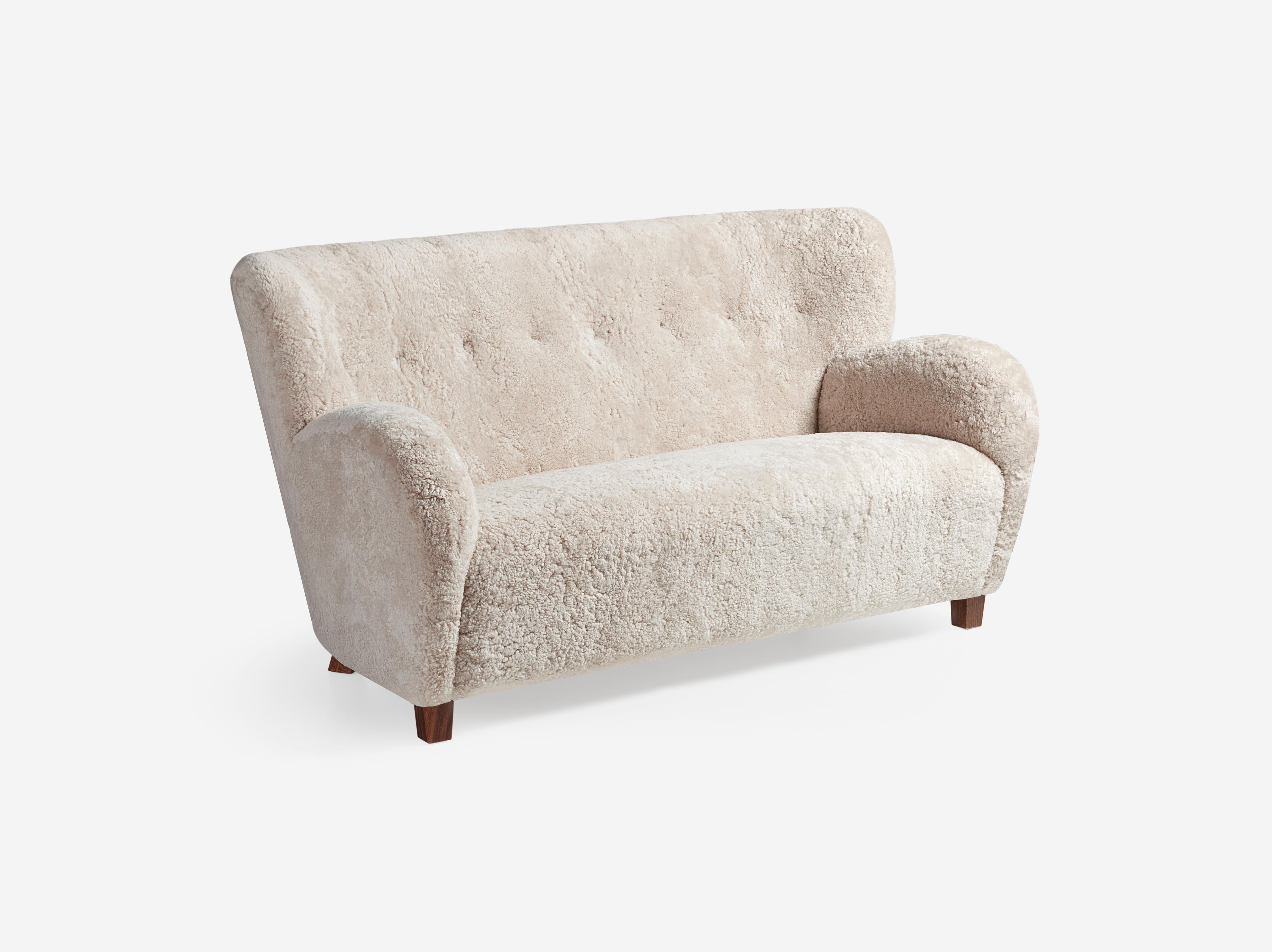 https://a.1stdibscdn.com/custom-made-sheepskin-karu-sofa-by-dagmar-for-sale-picture-2/f_13332/f_431187721736615655654/Dagmar_Karu_Sofa_155W_SK_Moonlight_Walnut_Angle_Wide_master.jpg