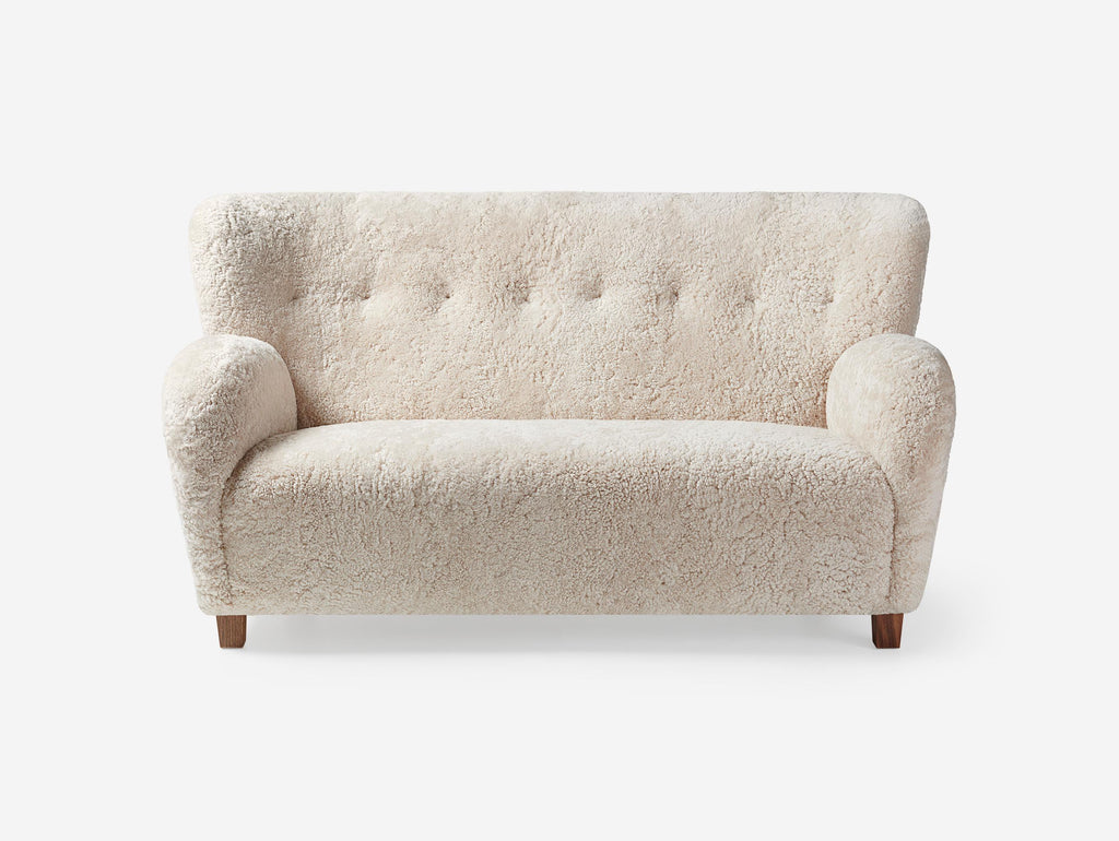https://a.1stdibscdn.com/custom-made-sheepskin-karu-sofa-by-dagmar-for-sale-picture-3/f_13332/f_431187721736615653672/Dagmar_Karu_Sofa_155W_SK_Moonlight_Walnut_Front_Wide_master.jpg