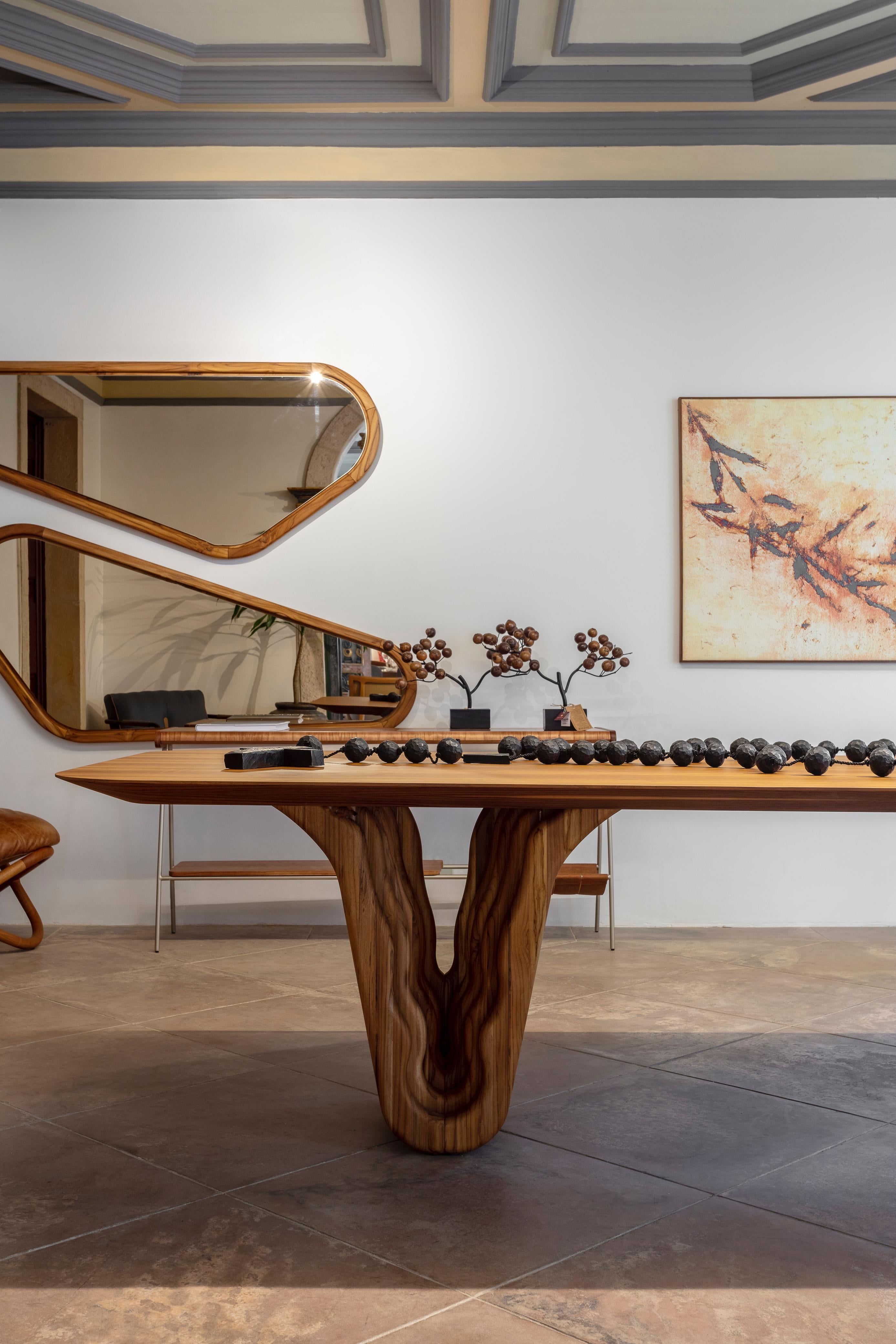 https://a.1stdibscdn.com/teak-wood-dining-table-with-sculptural-base-98-inches-top-dolomitas-collection-for-sale-picture-3/f_52822/f_346950421727870838904/Dolomitas_Dining_Table_1_master.jpg