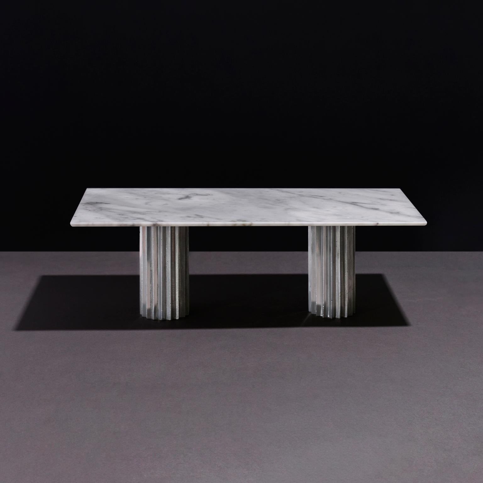 https://a.1stdibscdn.com/doris-double-pedestal-dining-table-in-white-carrara-marble-and-cast-aluminum-for-sale-picture-3/f_22063/f_152133621561757831887/Doris_amb_front_wcal_master.jpg