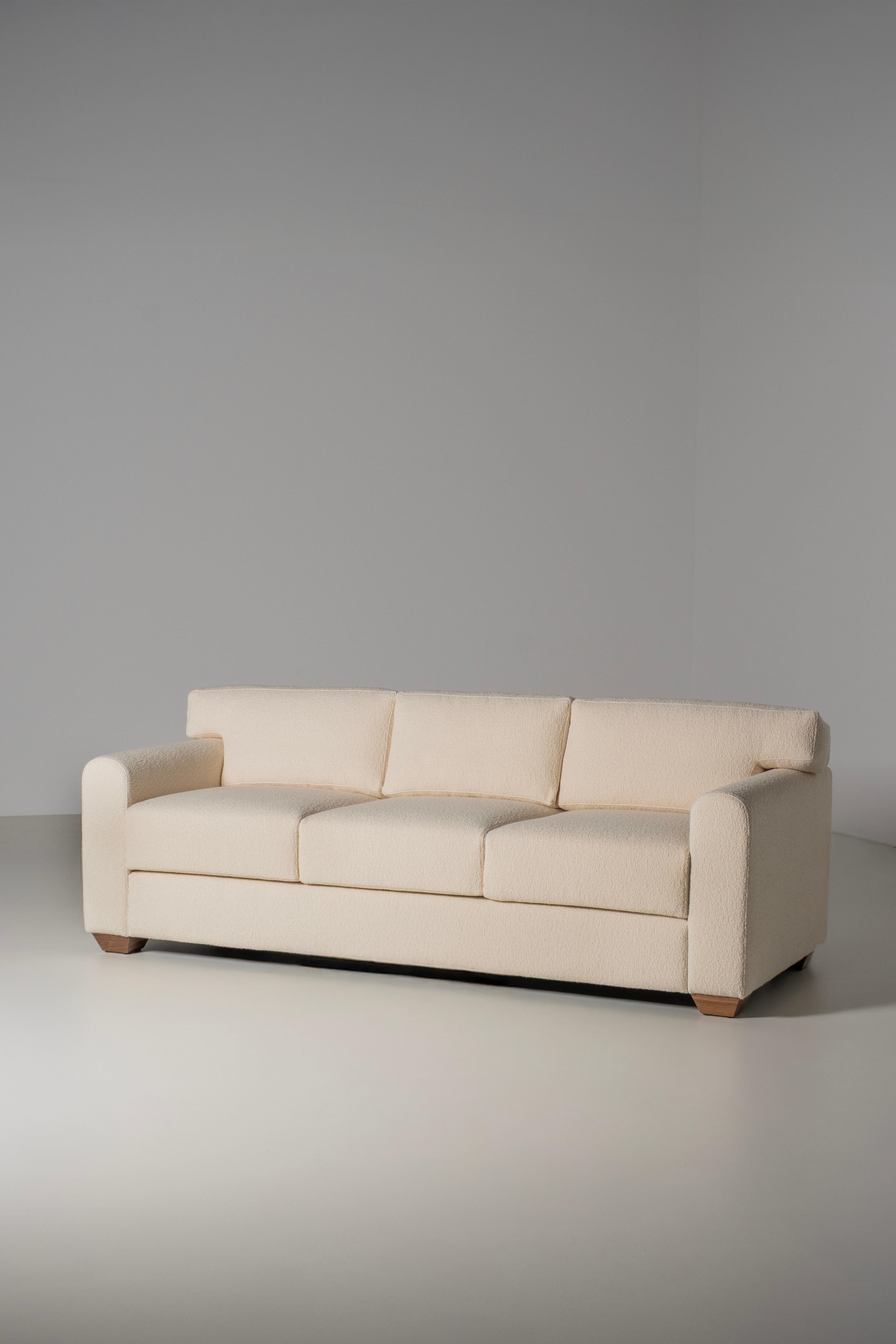 https://a.1stdibscdn.com/mid-century-modern-french-style-sofa-ivory-dedar-boucle-fabric-for-sale-picture-2/f_53532/f_462250221754934363627/E0029228_Export_master.jpg