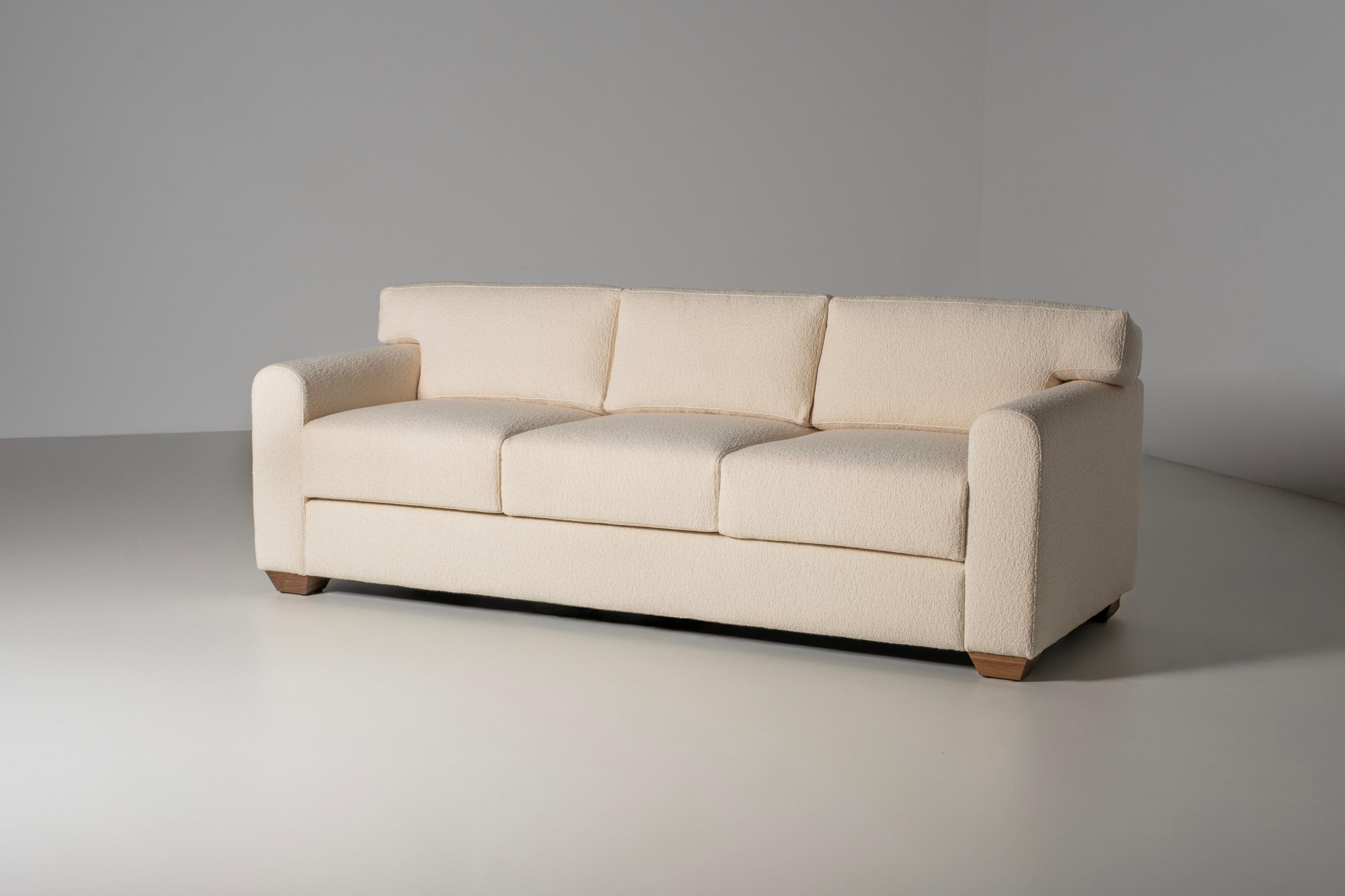 https://a.1stdibscdn.com/mid-century-modern-french-style-sofa-ivory-dedar-boucle-fabric-for-sale-picture-4/f_53532/f_462250221754934365104/E0029231_Export_master.jpg