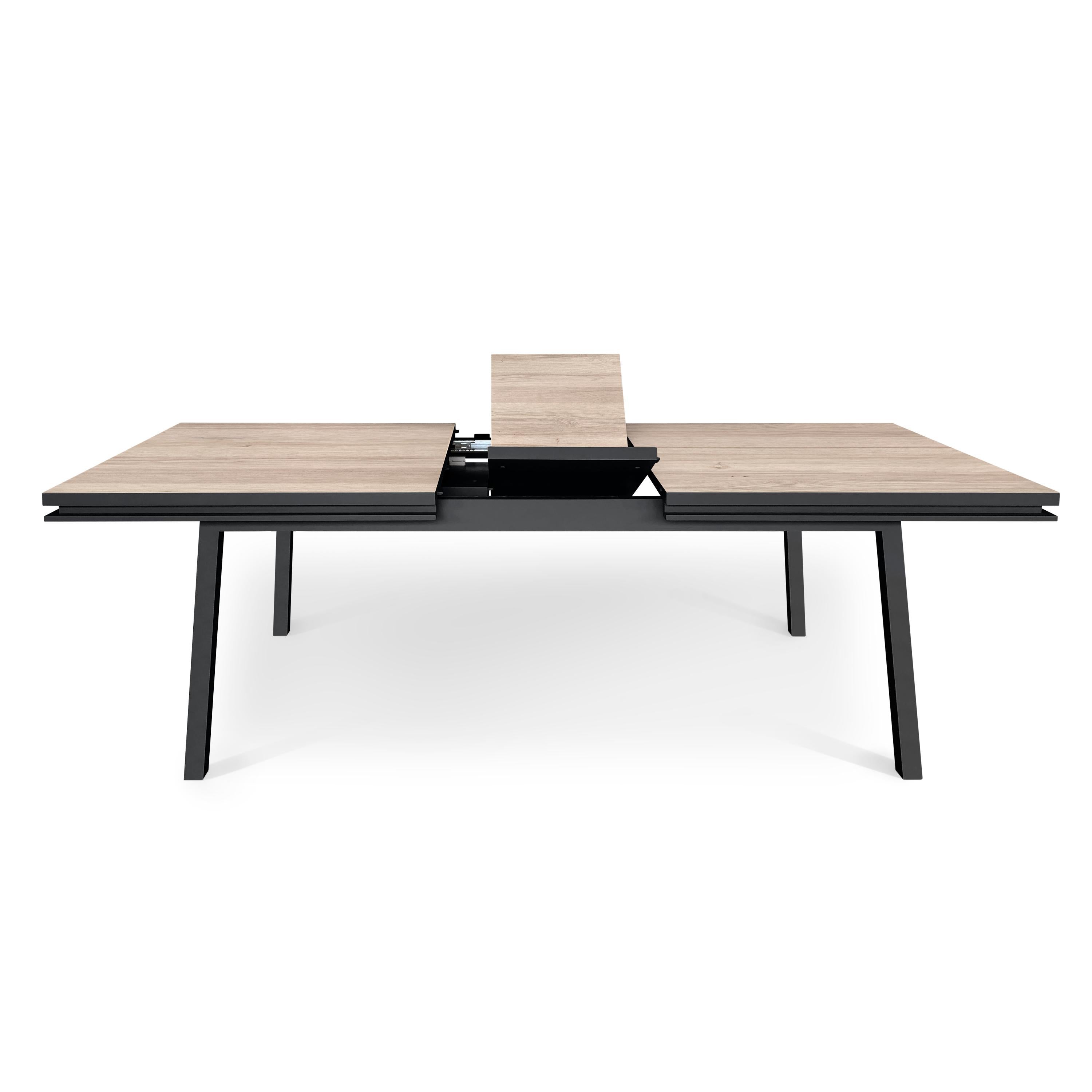https://a.1stdibscdn.com/rectangular-extensible-dining-table-in-solid-oak-design-by-eric-gizard-paris-for-sale-picture-3/f_57342/f_256705421633962874426/EG2_010CNO1800100_2_Table_repas_ch_ne_1_allonge_semi_d_pli_e_3000x3000_master.jpg