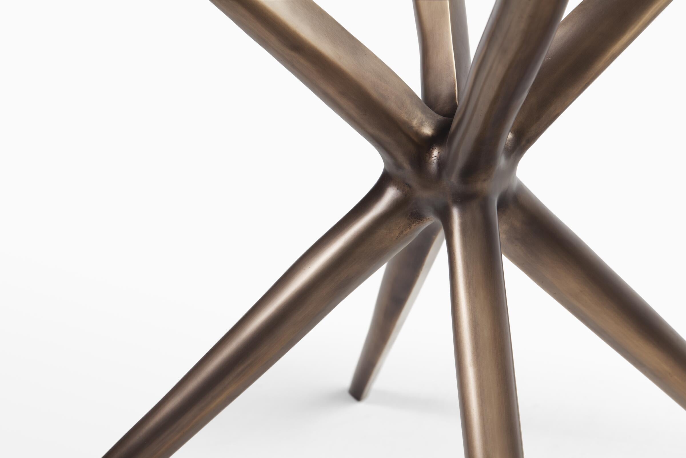 https://a.1stdibscdn.com/etoile-dining-table-monumnet-light-bronze-3-4-starfire-glass-for-sale-picture-3/f_34931/f_395053121714495226898/ET0_T_EtoileDiningTable_DET_master.jpg