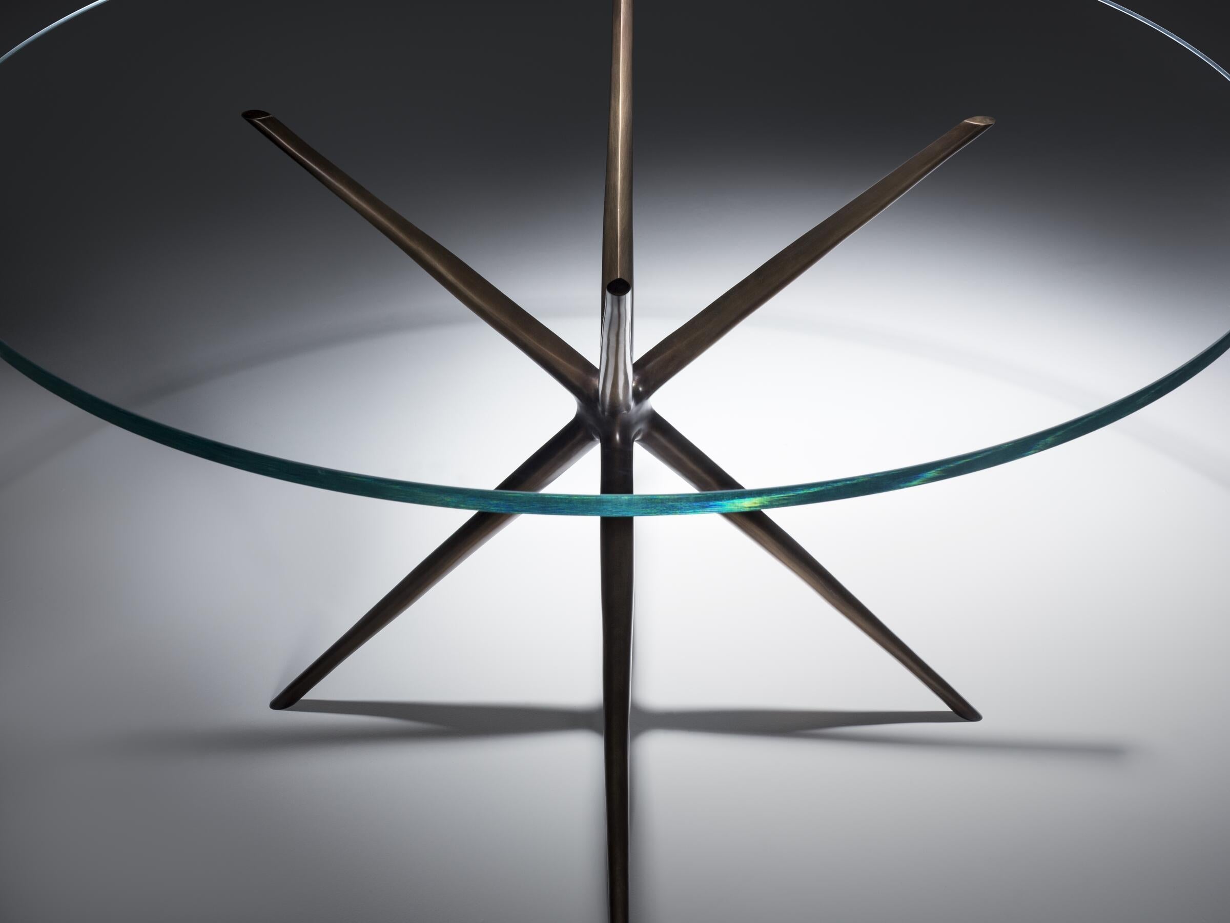 https://a.1stdibscdn.com/etoile-dining-table-monumnet-light-bronze-3-4-starfire-glass-for-sale-picture-2/f_34931/f_395053121714495218777/ET0_T_EtoileDiningTable_GAL_2_master.jpg