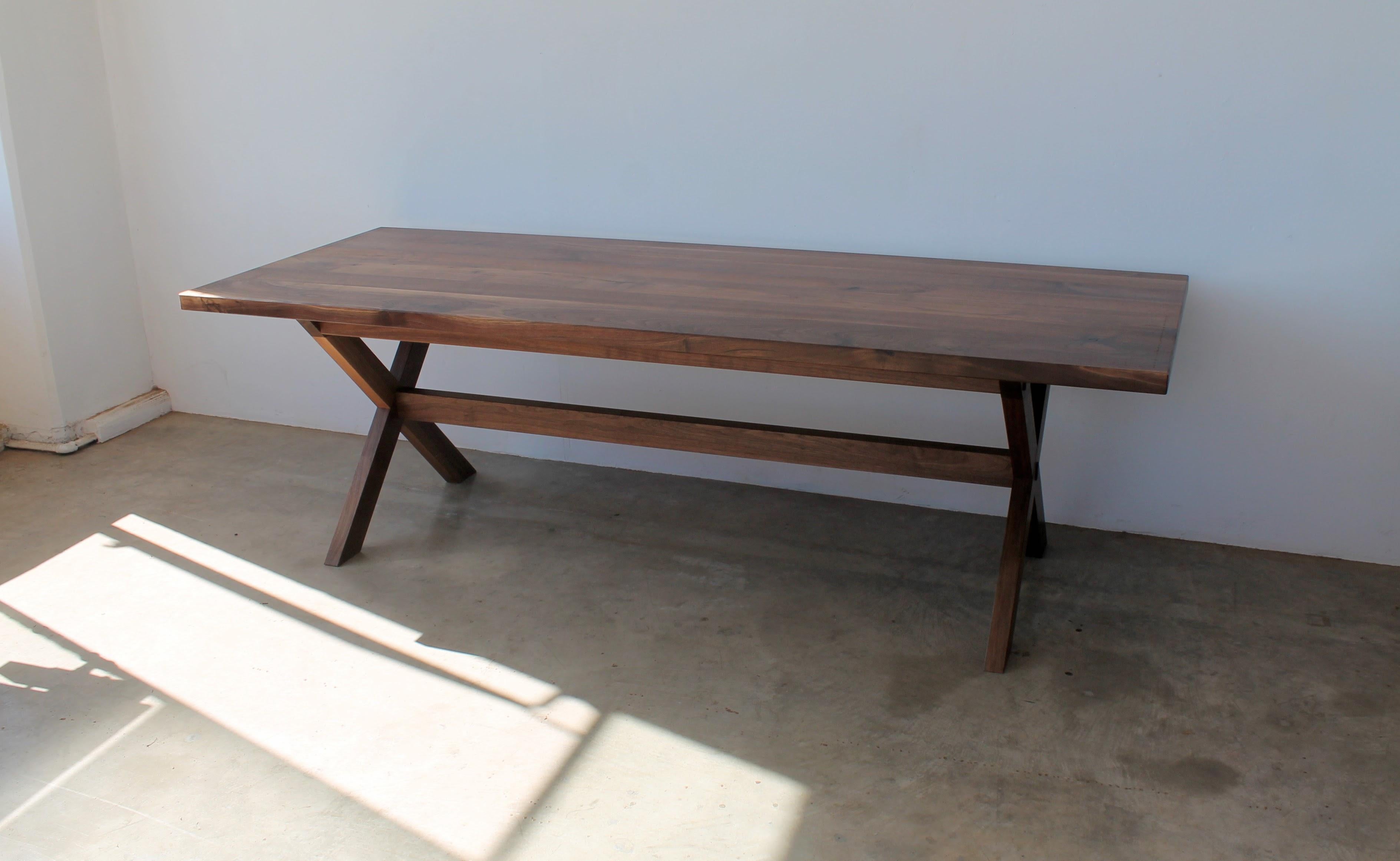 https://a.1stdibscdn.com/east-end-trestle-table-in-walnut-for-sale-picture-2/f_49771/f_228378221615667921887/East_End_Trestle_Walnut_2_master.JPG