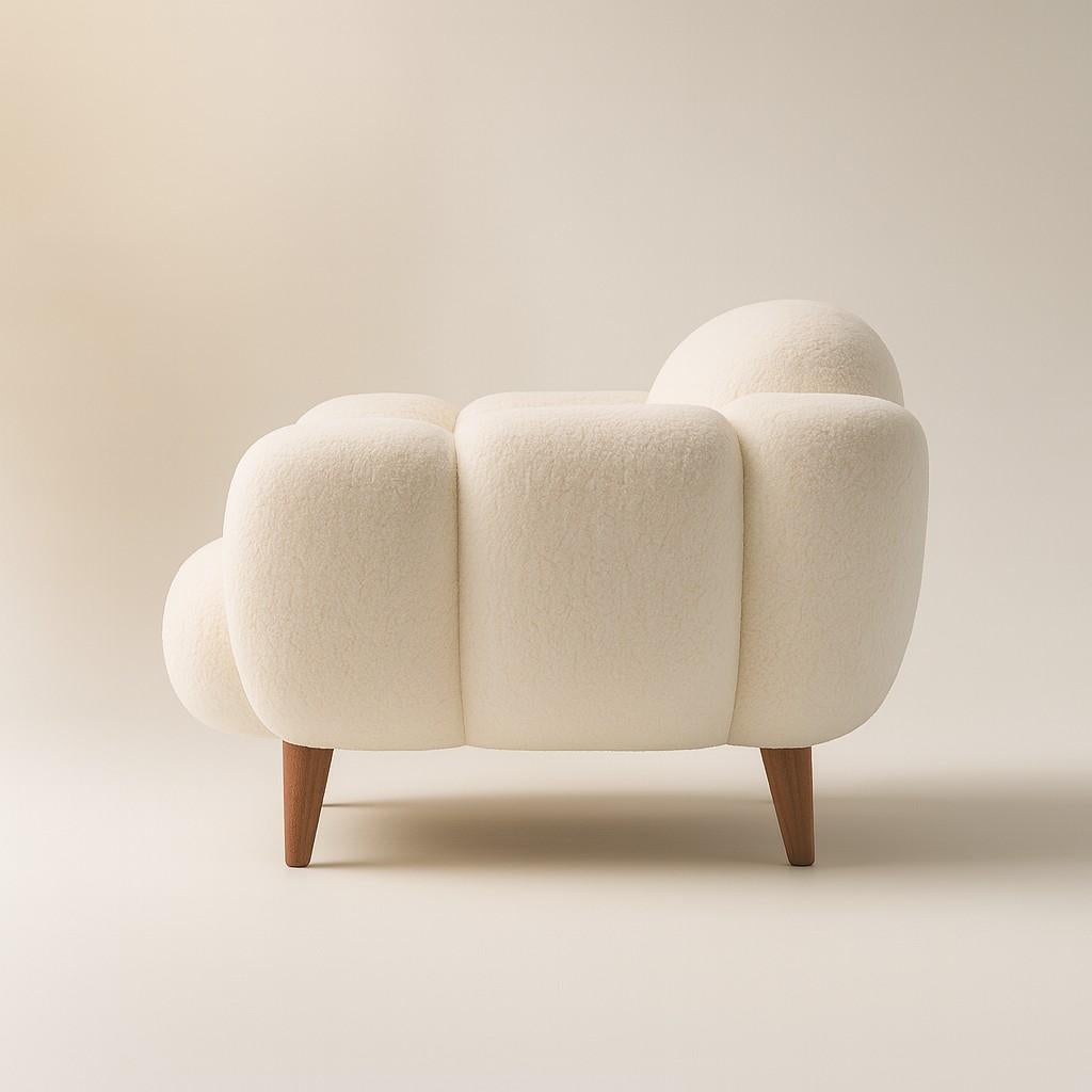 https://a.1stdibscdn.com/nuage-blanc-fauteuil-ivory-boucle-petal-arms-walnut-legs-by-sidani-design-for-sale-picture-2/f_27693/f_465468321757099141007/Elegant_Boucl_Armchair_with_Wooden_Legs_master.jpg