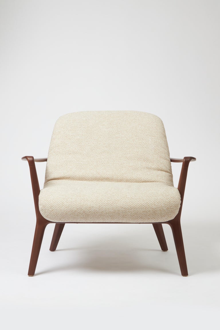 https://a.1stdibscdn.com/minimal-style-insigne-armchair-sculpted-in-walnut-wood-finish-textiles-seating-for-sale-picture-2/f_35593/f_391247321712182196362/Emp_rio_das_Cadeiras0731_master.jpg?width=768