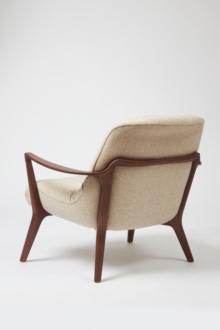 https://a.1stdibscdn.com/minimal-style-insigne-armchair-sculpted-in-walnut-wood-finish-textiles-seating-for-sale-picture-5/f_35593/f_391247321712182113116/Emp_rio_das_Cadeiras0735_master.jpg?width=768