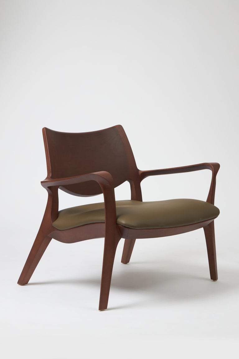 https://a.1stdibscdn.com/modern-style-aurora-armchair-sculpted-in-solid-wood-caning-back-leather-seat-for-sale-picture-17/f_35593/f_390931821711998317811/Emp_rio_das_Cadeiras0737_master.jpg?width=768