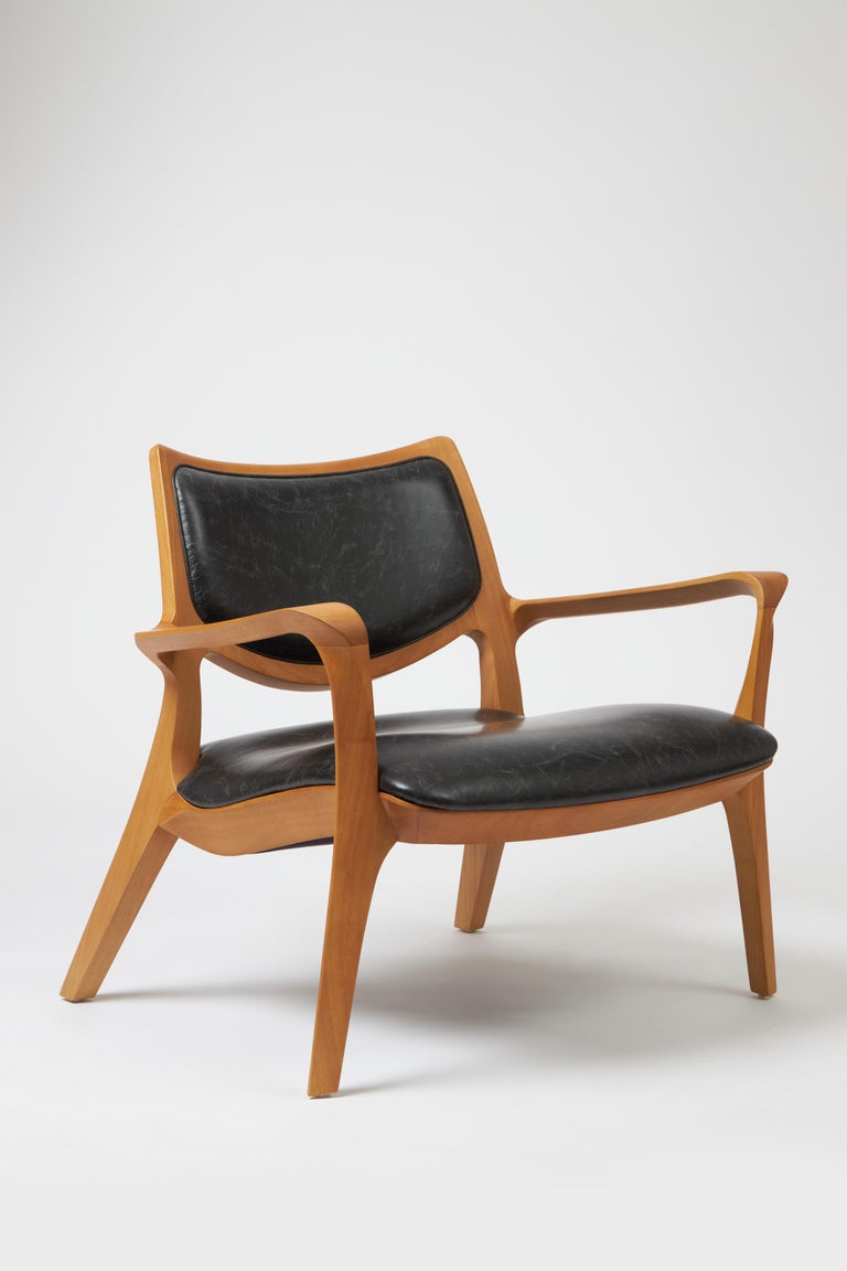 https://a.1stdibscdn.com/modern-style-aurora-armchair-sculpted-in-solid-wood-caning-back-leather-seat-for-sale-picture-18/f_35593/f_390931821711998368968/Emp_rio_das_Cadeiras0747_master.jpg?width=768