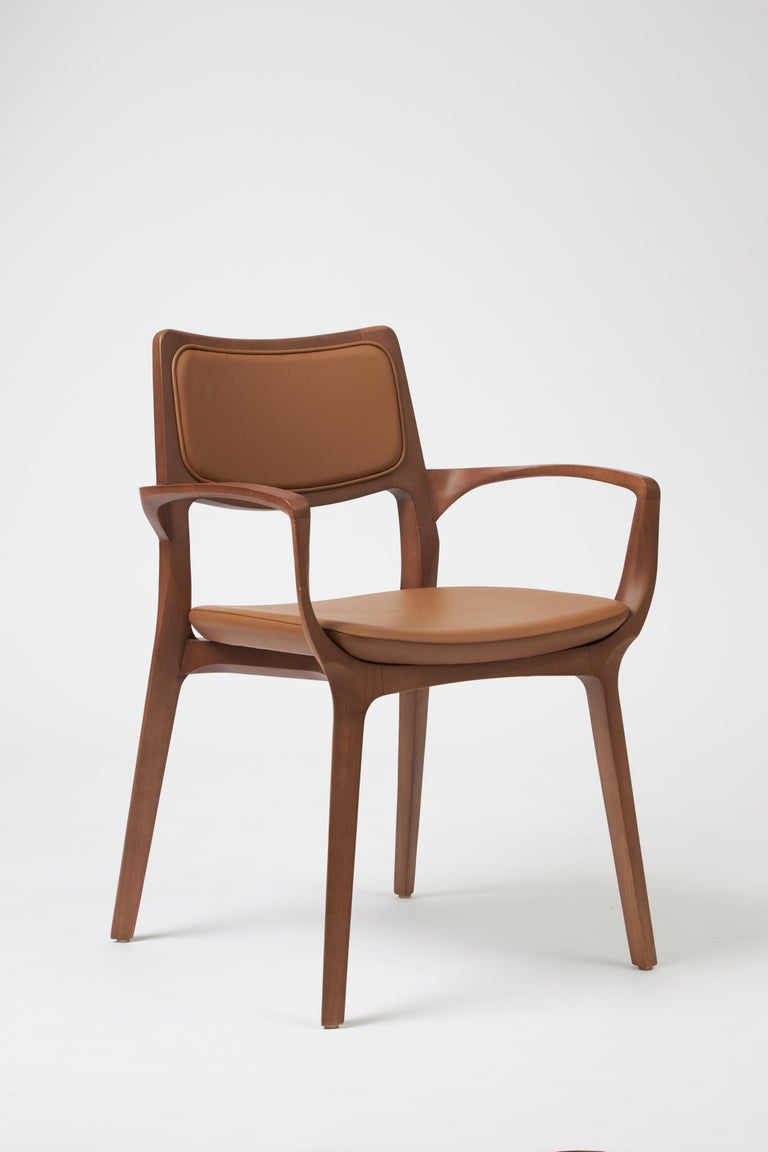 https://a.1stdibscdn.com/modern-style-aurora-chair-sculpted-in-walnut-finish-arms-leather-back-seating-for-sale-picture-2/f_35593/f_390205821711487217417/Emp_rio_das_Cadeiras0757_master.jpg?width=768