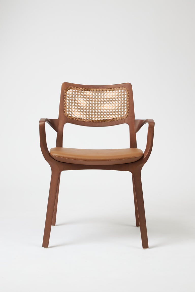 https://a.1stdibscdn.com/modern-style-aurora-chair-sculpted-in-walnut-finish-arms-leather-seating-cane-for-sale-picture-2/f_35593/f_390205621711486999880/Emp_rio_das_Cadeiras0761_master.jpg?width=768