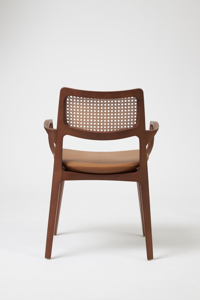 https://a.1stdibscdn.com/modern-style-aurora-chair-sculpted-in-walnut-finish-arms-leather-seating-cane-for-sale-picture-4/f_35593/f_390205621711486898838/Emp_rio_das_Cadeiras0764_master.jpg?width=768