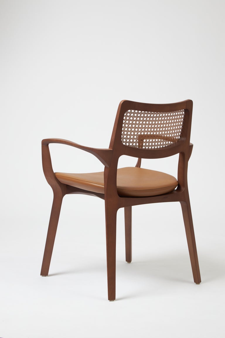 https://a.1stdibscdn.com/modern-style-aurora-chair-sculpted-in-walnut-finish-arms-leather-seating-cane-for-sale-picture-5/f_35593/f_390205621711486899796/Emp_rio_das_Cadeiras0765_master.jpg?width=768