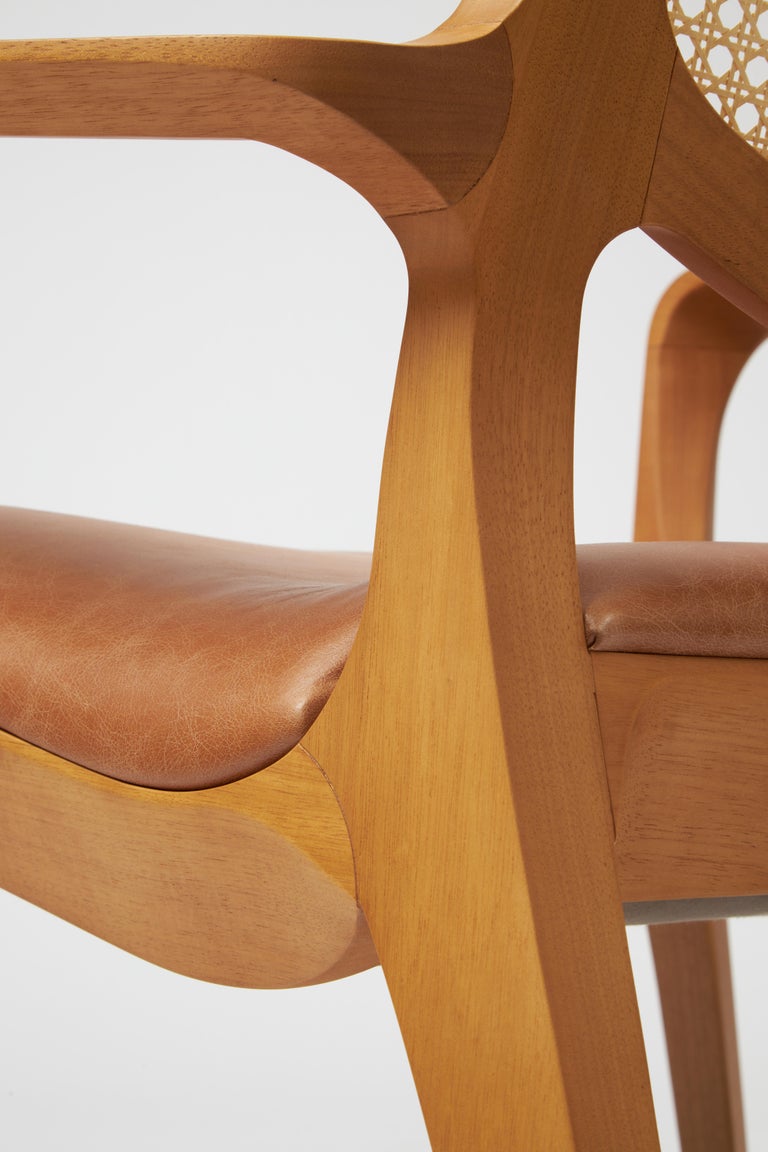 https://a.1stdibscdn.com/modern-style-aurora-armchair-sculpted-in-solid-wood-caning-back-leather-seat-for-sale-picture-12/f_35593/f_390931821711998924440/Emp_rio_das_Cadeiras0815_master.jpg?width=768