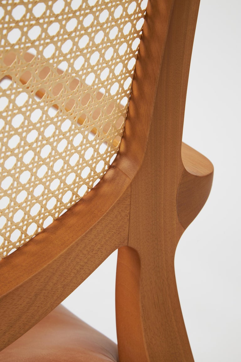 https://a.1stdibscdn.com/modern-style-aurora-armchair-sculpted-in-solid-wood-caning-back-leather-seat-for-sale-picture-8/f_35593/f_390931821711998921620/Emp_rio_das_Cadeiras0819_master.jpg?width=768