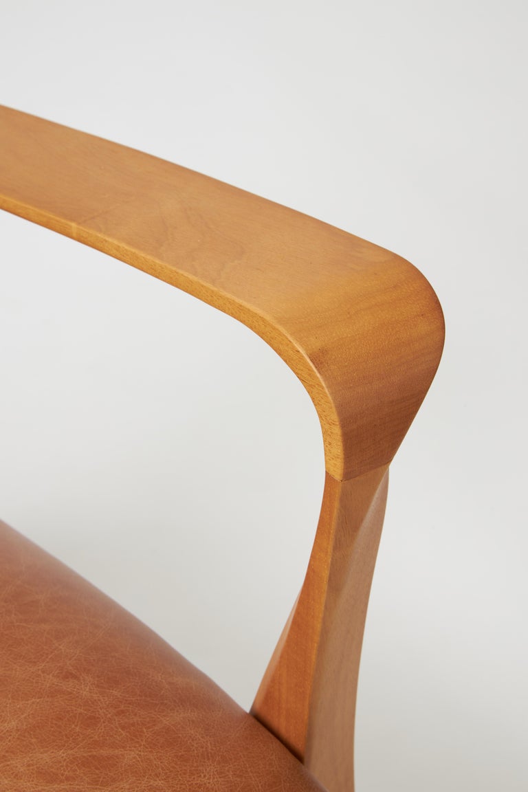 https://a.1stdibscdn.com/modern-style-aurora-armchair-sculpted-in-solid-wood-caning-back-leather-seat-for-sale-picture-6/f_35593/f_390931821711998921004/Emp_rio_das_Cadeiras0825_master.jpg?width=768