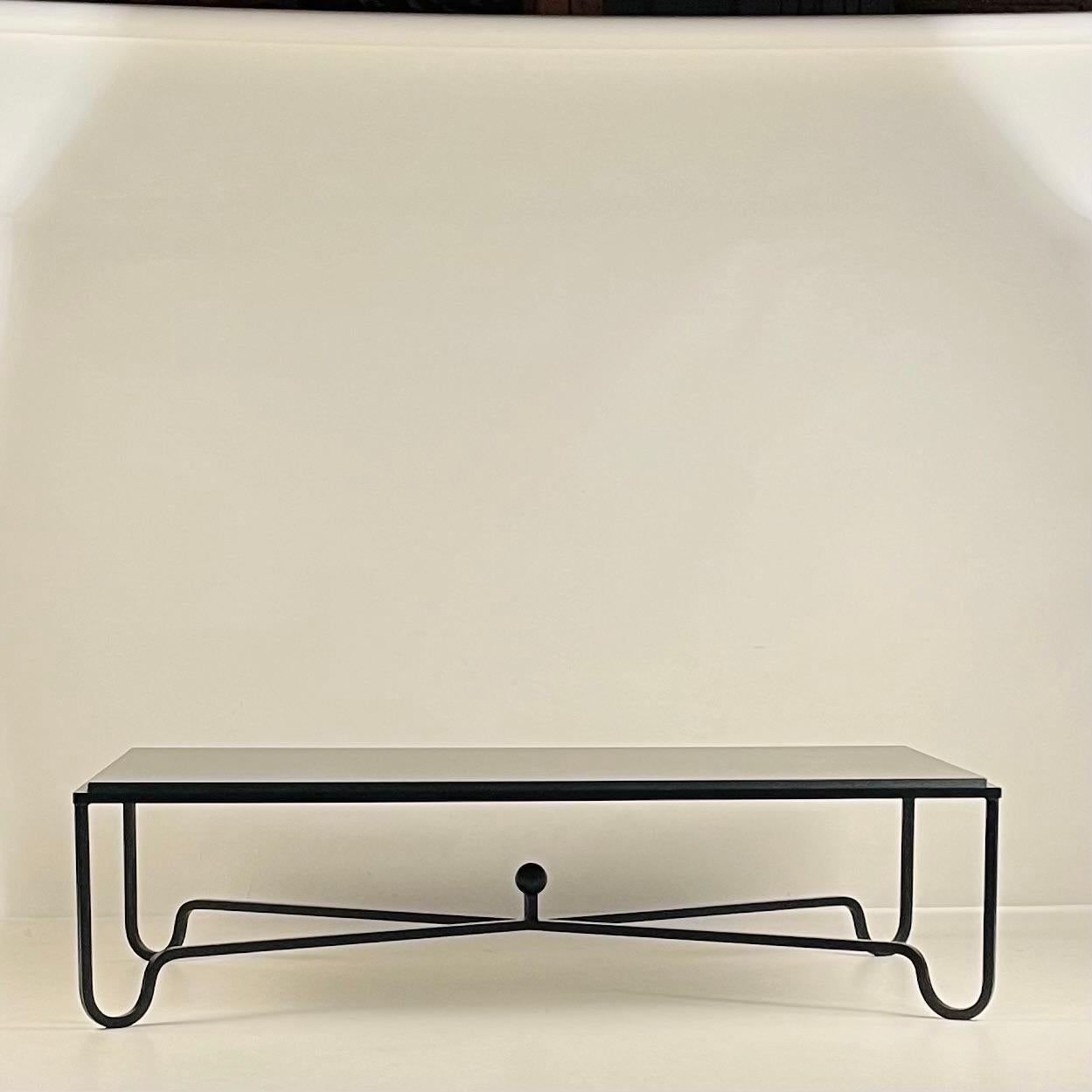 https://a.1stdibscdn.com/large-black-limestone-entretoise-coffee-table-by-design-freres-for-sale-picture-2/f_8184/f_451113821747764912345/Entretoise_Black_Limestone_Coffee_Table_5_master.jpg