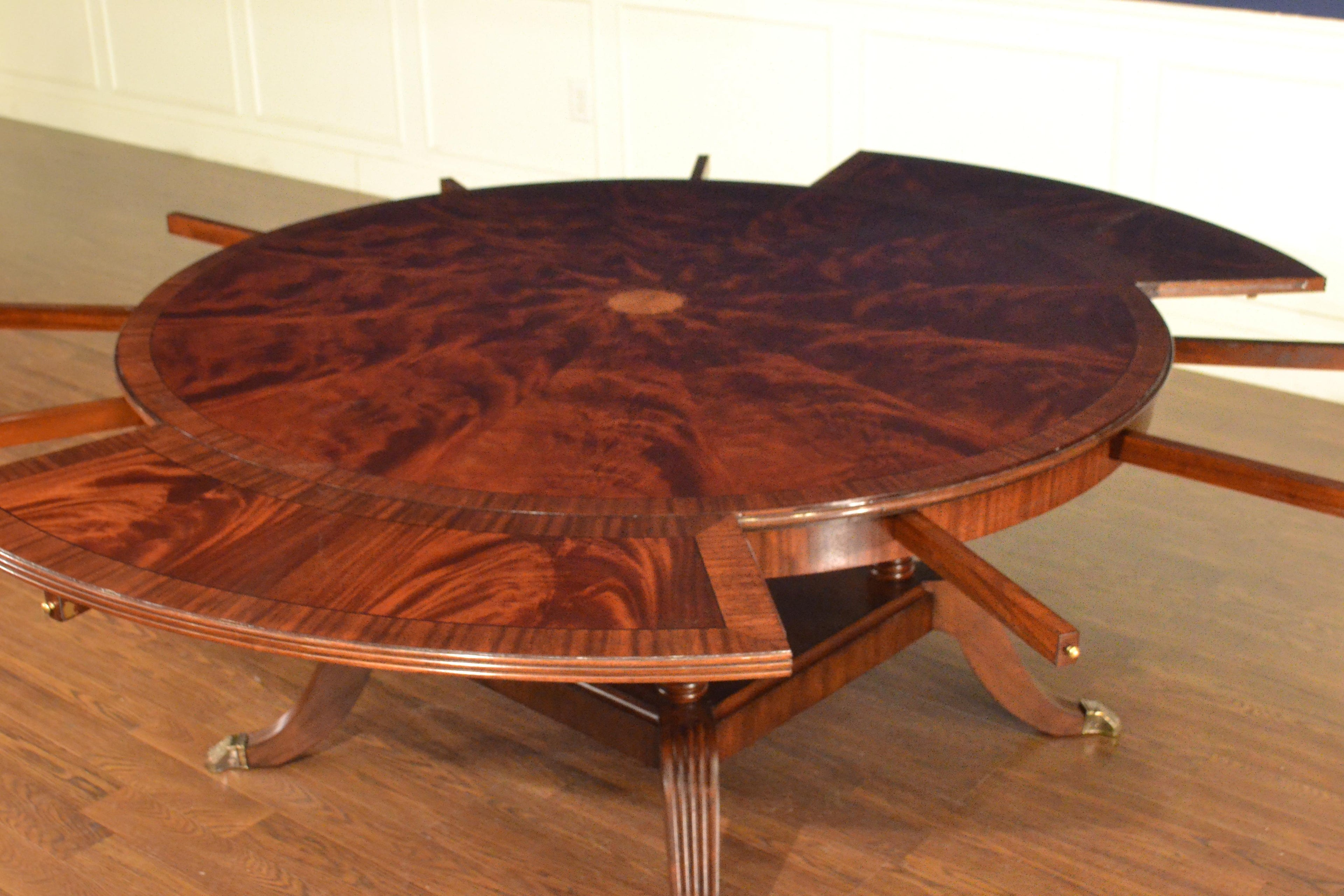 https://a.1stdibscdn.com/large-round-perimeter-leaf-mahogany-georgian-style-dining-table-by-leighton-hall-for-sale-picture-10/f_44162/f_146972821557706140380/F67791CD_D8F1_4161_82C3_22AF9C2B0C25_master.jpeg