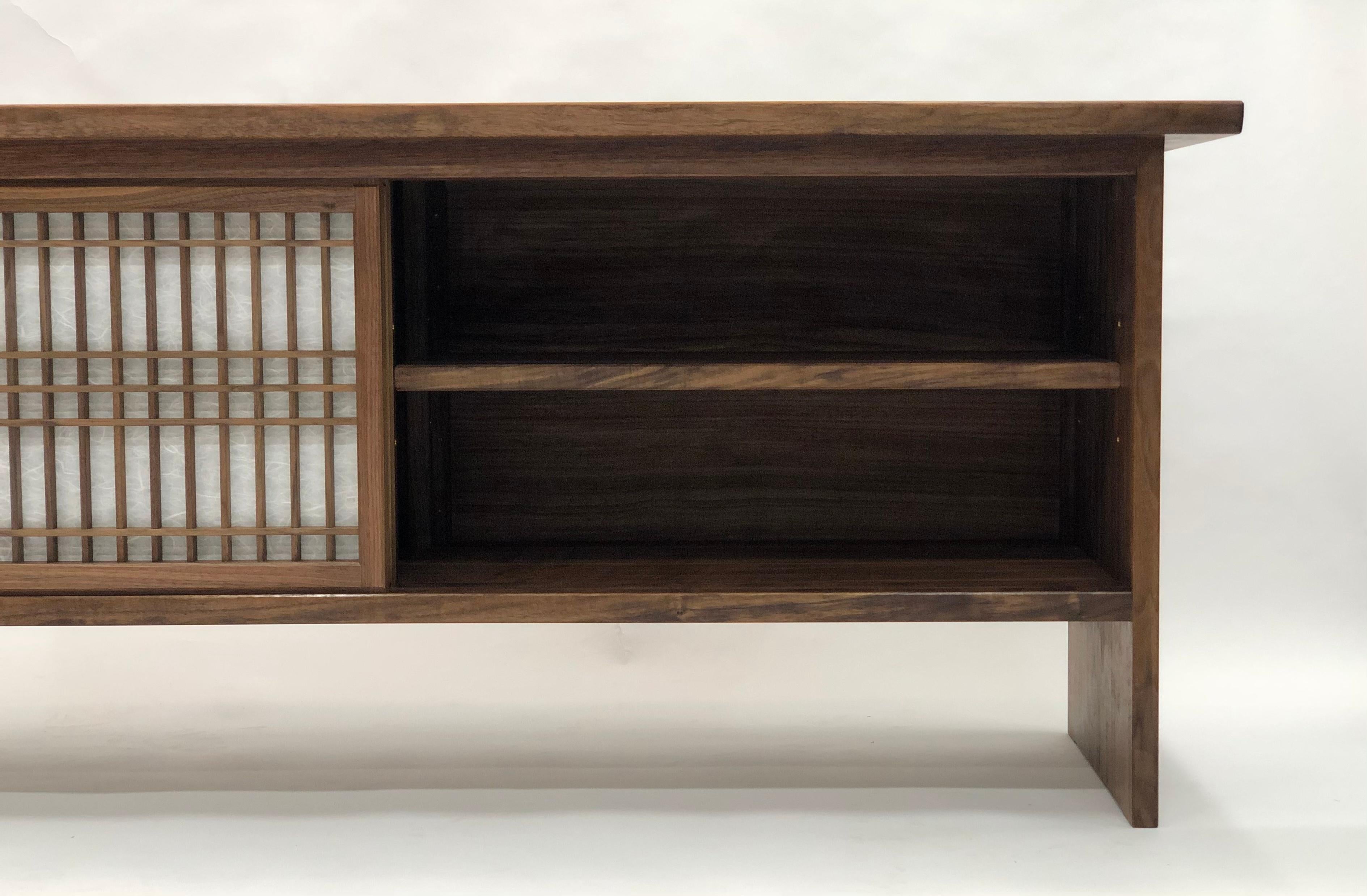 https://a.1stdibscdn.com/walnut-credenza-with-sliding-shoji-doors-for-sale-picture-9/f_45782/f_224459721612735303953/FA4E0715_FE52_4DDD_8EA7_720C03F4A3AC_master.jpeg