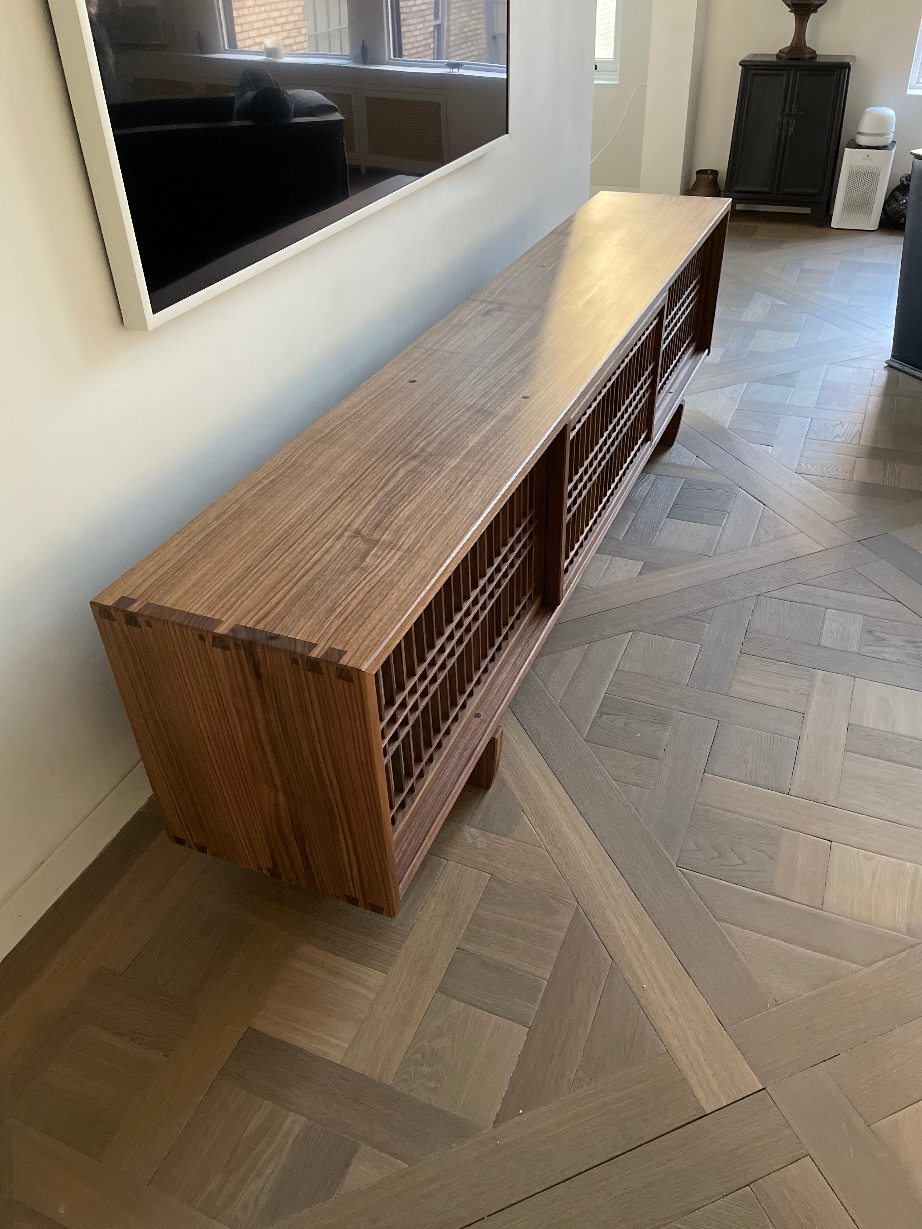 https://a.1stdibscdn.com/walnut-media-console-room-divider-with-sliding-shoji-doors-for-sale-picture-6/f_45782/f_22707762/FC4A831B_F2E4_45F2_8518_1614352190694_master.jpeg