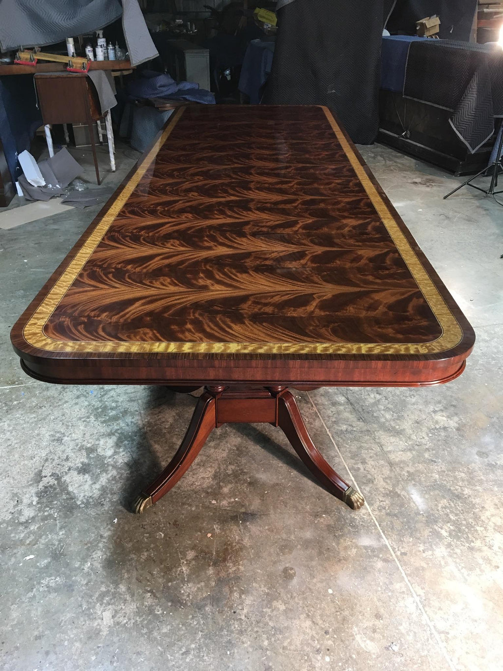 https://a.1stdibscdn.com/large-mahogany-regency-style-banquet-table-by-leighton-hall-for-sale-picture-8/f_44162/f_135373121550251399649/FCE08BB2_0FBC_4EE9_8A64_4E56EA404742_master.jpeg