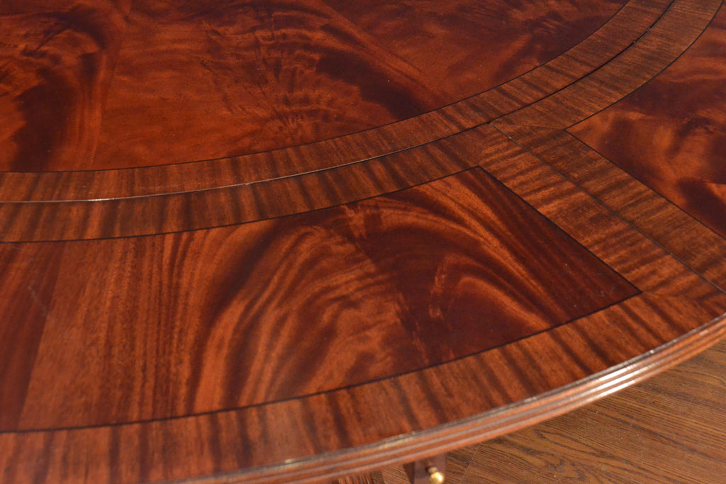 https://a.1stdibscdn.com/large-round-perimeter-leaf-mahogany-georgian-style-dining-table-by-leighton-hall-for-sale-picture-5/f_44162/f_146972821557705788957/FCFF6559_C572_4B0A_A5B7_B85E97433B8C_master.jpeg