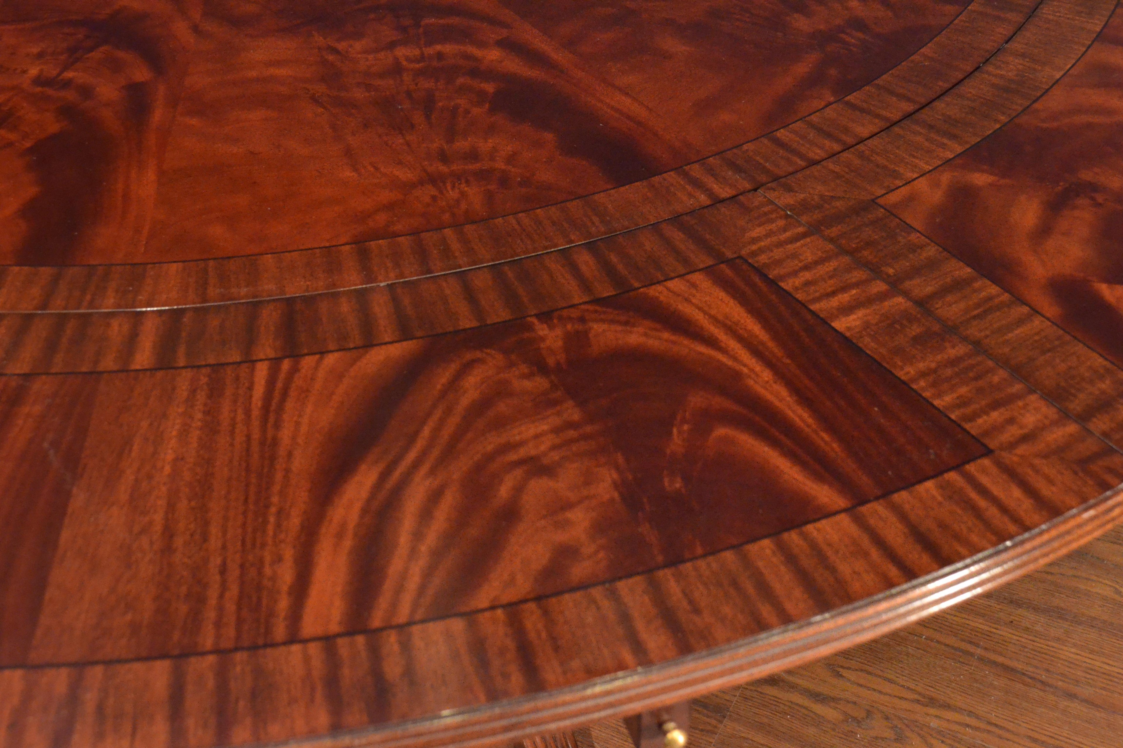 https://a.1stdibscdn.com/large-round-perimeter-leaf-mahogany-georgian-style-dining-table-by-leighton-hall-for-sale-picture-5/f_44162/f_146972821557705788957/FCFF6559_C572_4B0A_A5B7_B85E97433B8C_master.jpeg