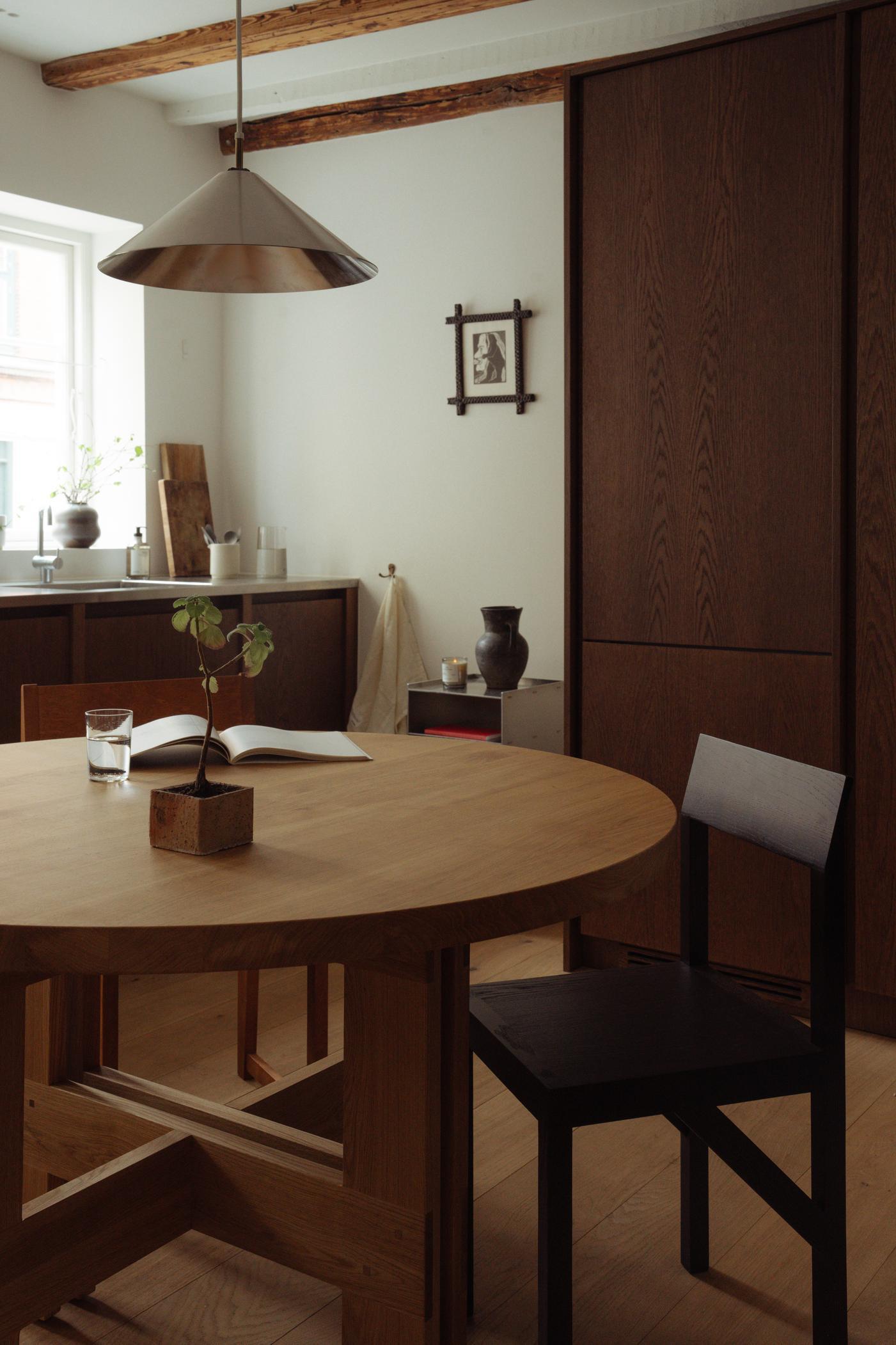 https://a.1stdibscdn.com/contemporary-trestle-table-farmhouse-by-frama-natural-oak-120-round-for-sale-picture-13/f_31233/f_483338421768470408744/FRAMA_Compact_Living_Context_Images_56_master.jpg