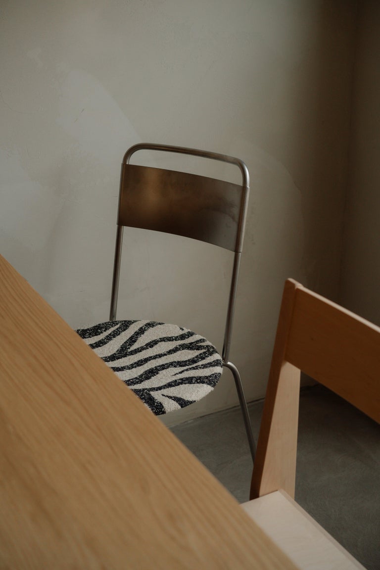 https://a.1stdibscdn.com/contemporary-chair-petit-rond-troels-grum-schwensen-x-frama-steel-and-zebra-for-sale-picture-5/f_31233/f_479344221765367594543/FRAMA_Petit_Rond_Zebra_Context_Image_01_min_master.jpg?width=768