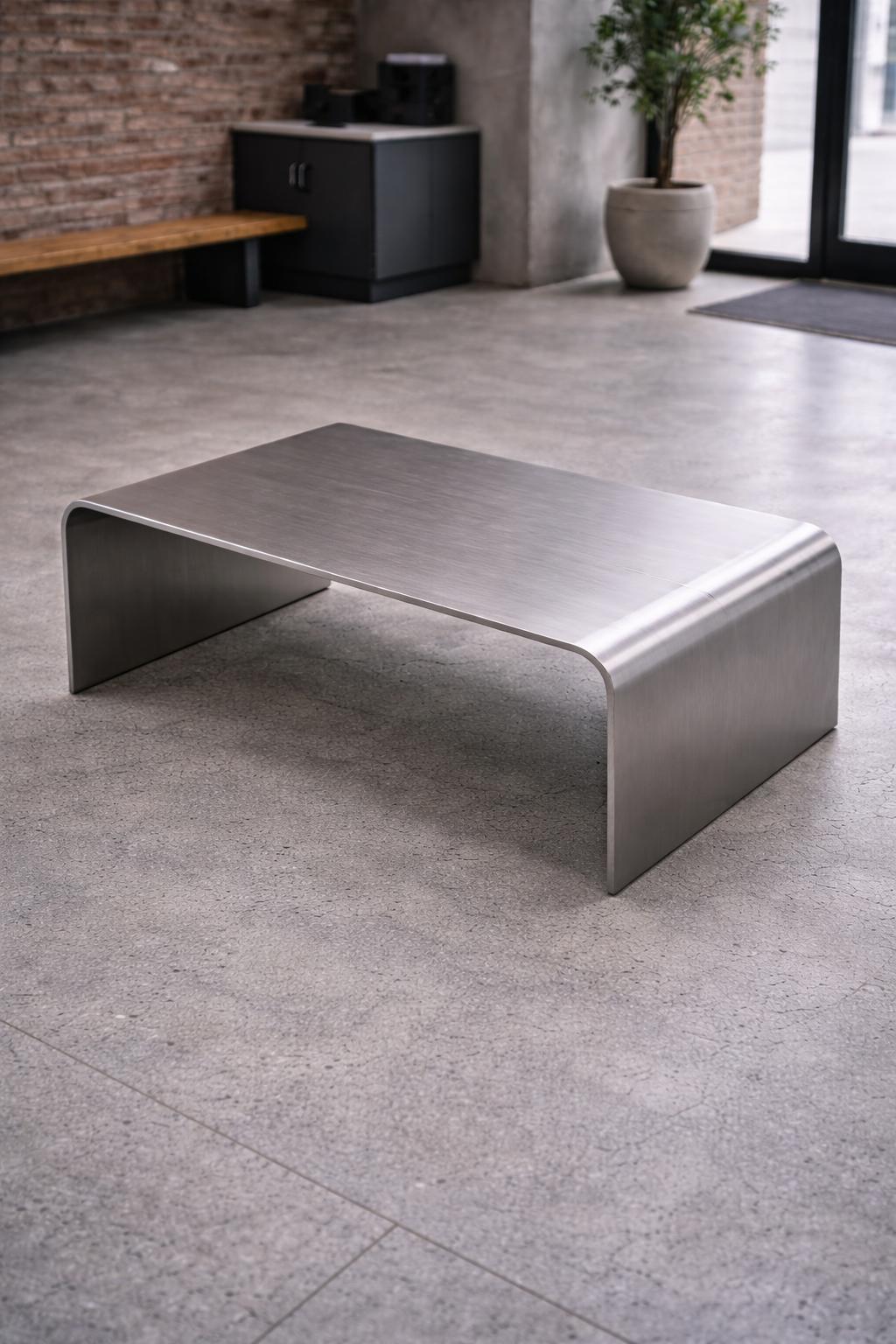 https://a.1stdibscdn.com/flow-sculptural-waterfall-coffee-table-in-aluminum-by-veliento-for-sale-picture-5/f_12192/f_491602921773141446622/Flow_04_master.jpg