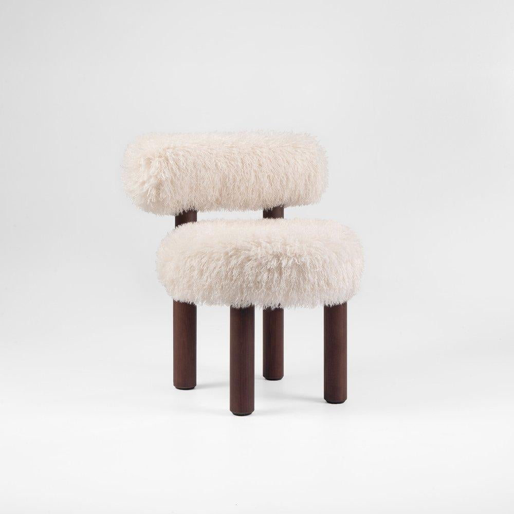 https://a.1stdibscdn.com/contemporary-dining-chair-fluffy-by-noom-gropius-cs2-orange-for-sale-picture-8/f_31233/f_387213321709718939457/Fluffy_Chair_Gropius_CS2_in_Azur_Cotonneux_Faux_Fur_2__master.jpeg