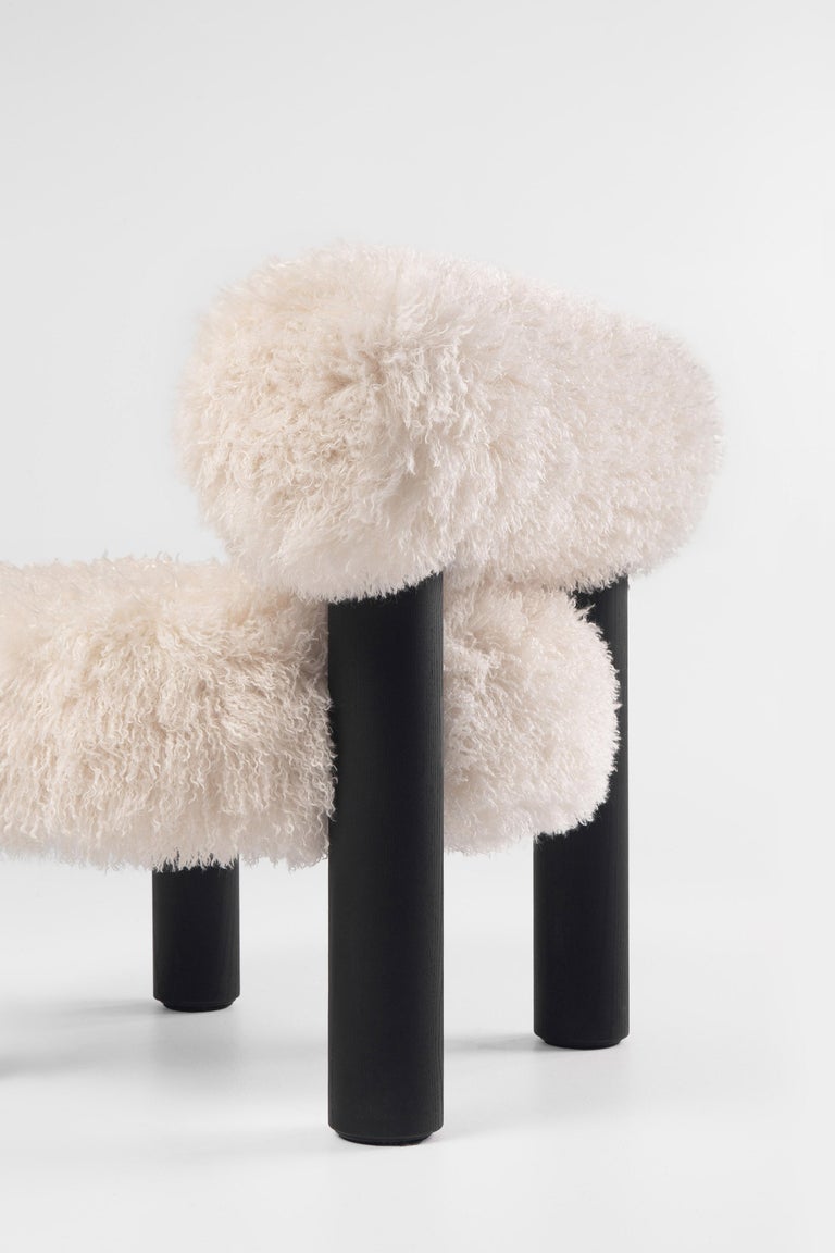 https://a.1stdibscdn.com/modern-low-chair-gropius-cs2-fluffy-in-azur-faux-fur-with-wooden-legs-by-noom-for-sale-picture-7/f_42321/f_422472121731182054262/Fluffy_Low_Chair_Gropius_CS2_in_Azur_Cotonneux_Faux_Fur_10__master.jpg?width=768