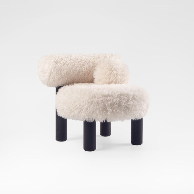 https://a.1stdibscdn.com/modern-low-chair-gropius-cs2-fluffy-in-azur-faux-fur-with-wooden-legs-by-noom-for-sale-picture-2/f_42321/f_422472121731182215829/Fluffy_Low_Chair_Gropius_CS2_in_Azur_Cotonneux_Faux_Fur_2__master.jpg?width=768