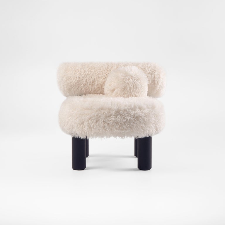 https://a.1stdibscdn.com/modern-low-chair-gropius-cs2-fluffy-in-azur-faux-fur-with-wooden-legs-by-noom-for-sale-picture-3/f_42321/f_422472121731182053551/Fluffy_Low_Chair_Gropius_CS2_in_Azur_Cotonneux_Faux_Fur_3__master.jpg?width=768