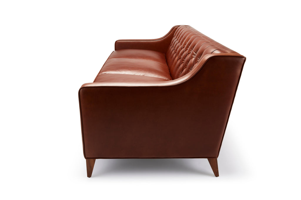 https://a.1stdibscdn.com/contemporary-leather-formalis-deep-buttoned-back-sofa-in-with-oak-or-walnut-legs-for-sale-picture-3/f_27813/f_436643821739800713473/FormalisSofa_brownleather9863_FIN_master.jpg