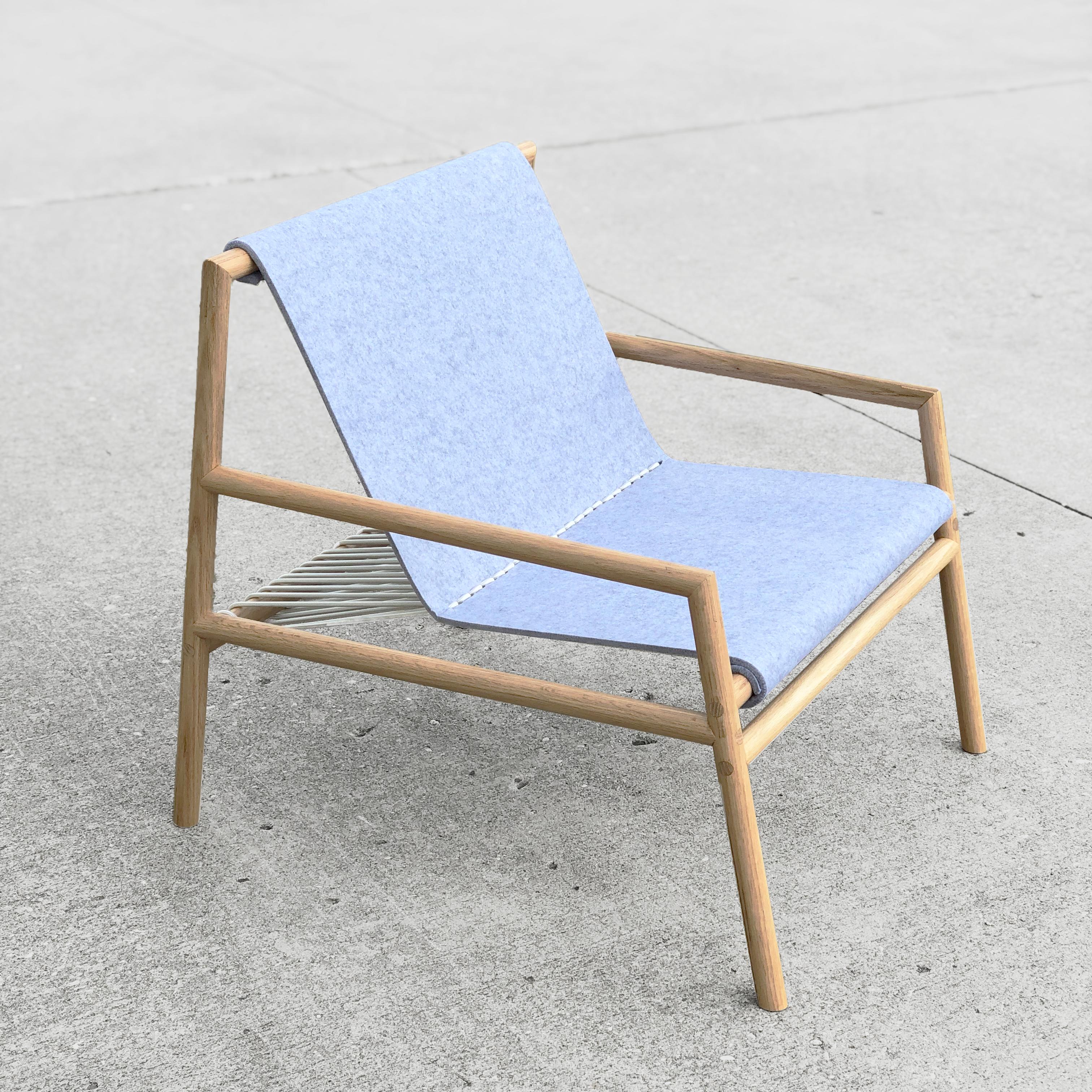 https://a.1stdibscdn.com/gallagher-lounge-chair-oak-wood-and-grey-felt-for-sale-picture-2/22569652/f_266329421640078105109/GAL_LNG_OAK_FLT_GRY1_master.jpg