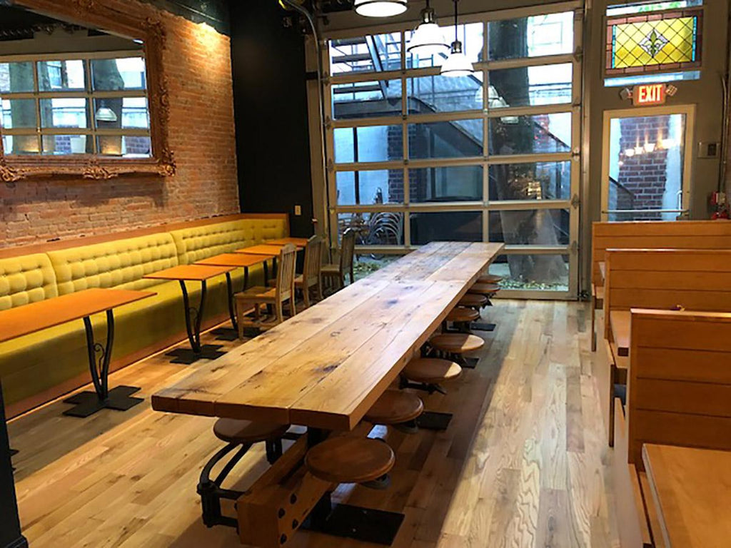 https://a.1stdibscdn.com/eight-seat-communal-steel-top-dining-table-with-cast-iron-attached-swing-seats-for-sale-picture-12/f_8299/f_10364141538056528623/GetBackInc_Swing_out_Seat_Communal_Table_Syracuse_1_master.jpg