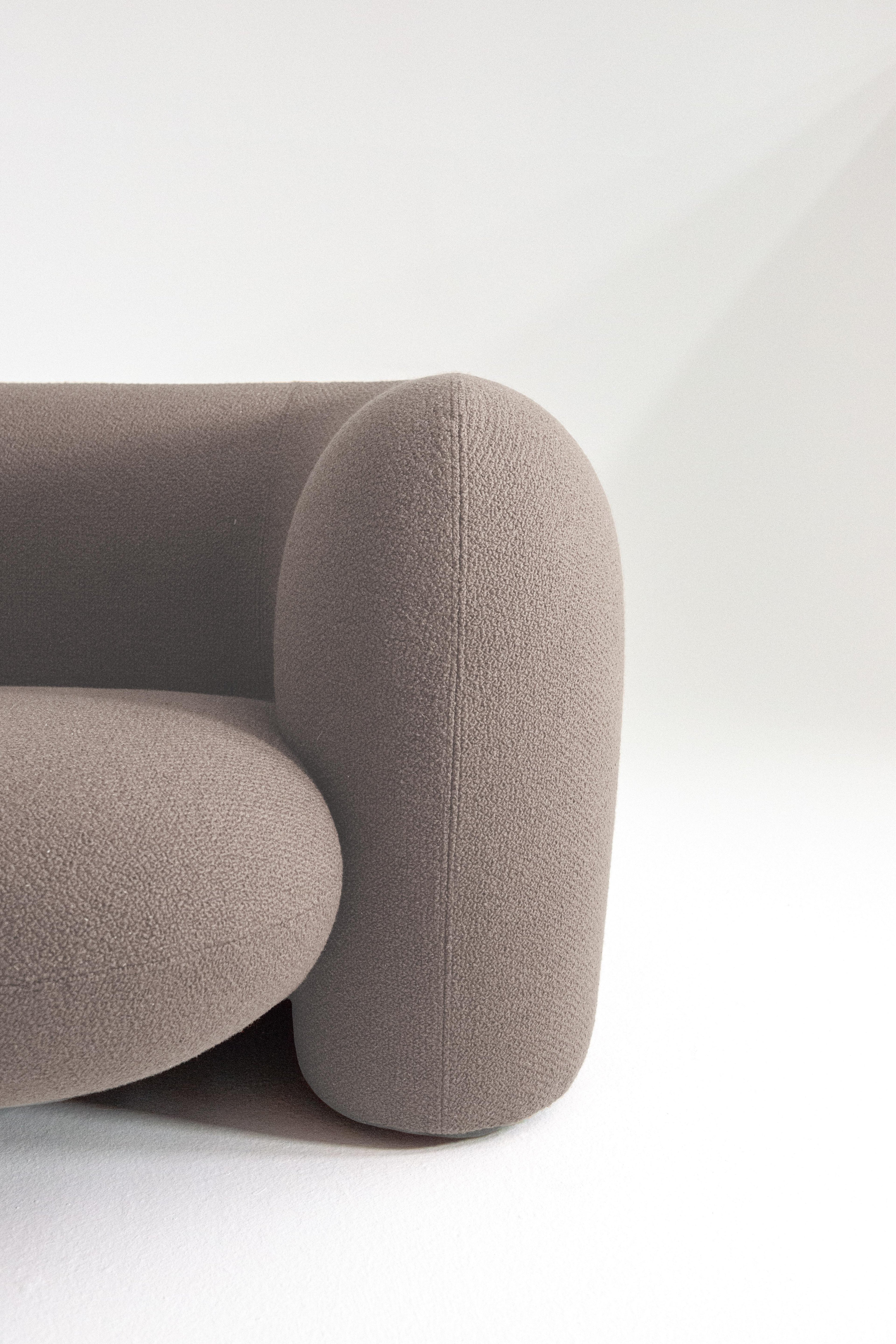 https://a.1stdibscdn.com/contemporary-curve-three-seater-sofa-by-hessentia-in-boucle-fabric-mink-colour-for-sale-picture-4/f_57252/f_359578521694686162165/Gio_ang_3_master.jpg