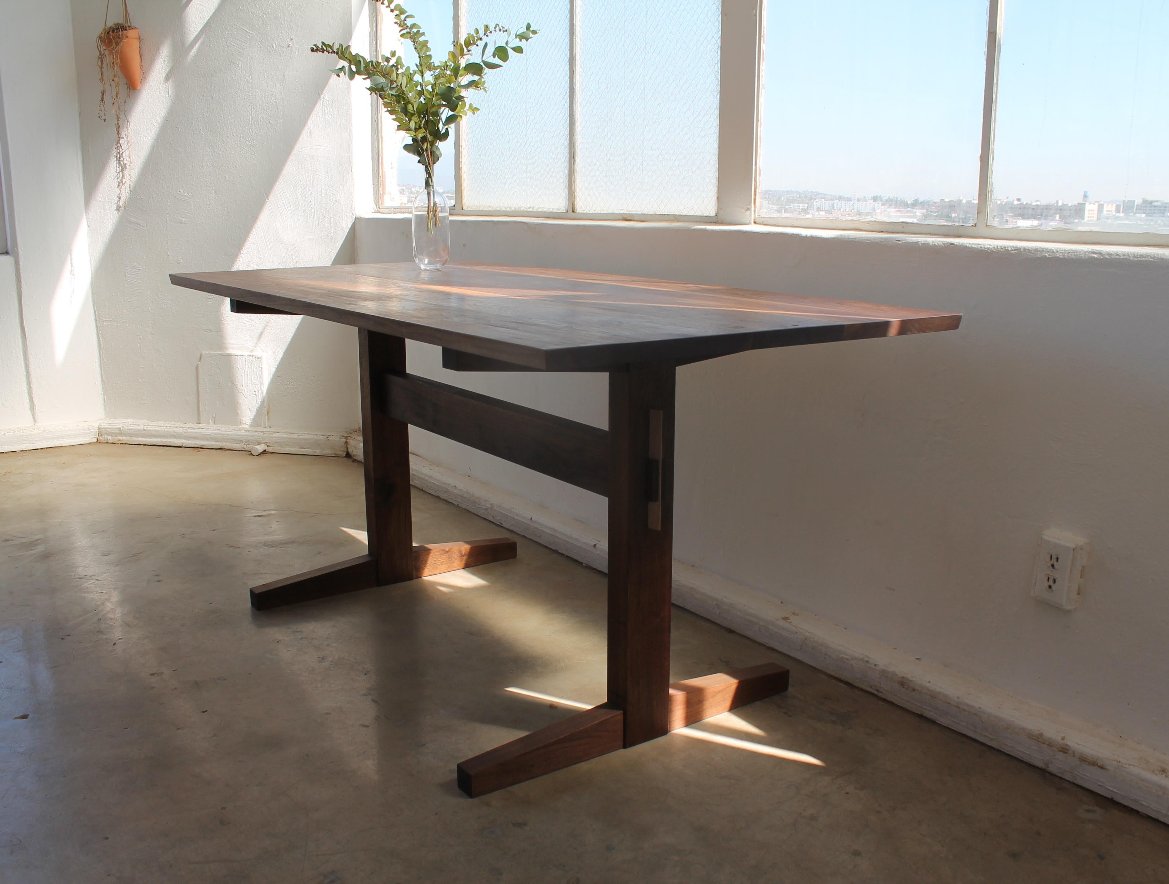 https://a.1stdibscdn.com/hana-walnut-trestle-dining-table-for-sale-picture-3/f_49771/f_326562321675826515065/Hana_Trestle_4_master.jpg