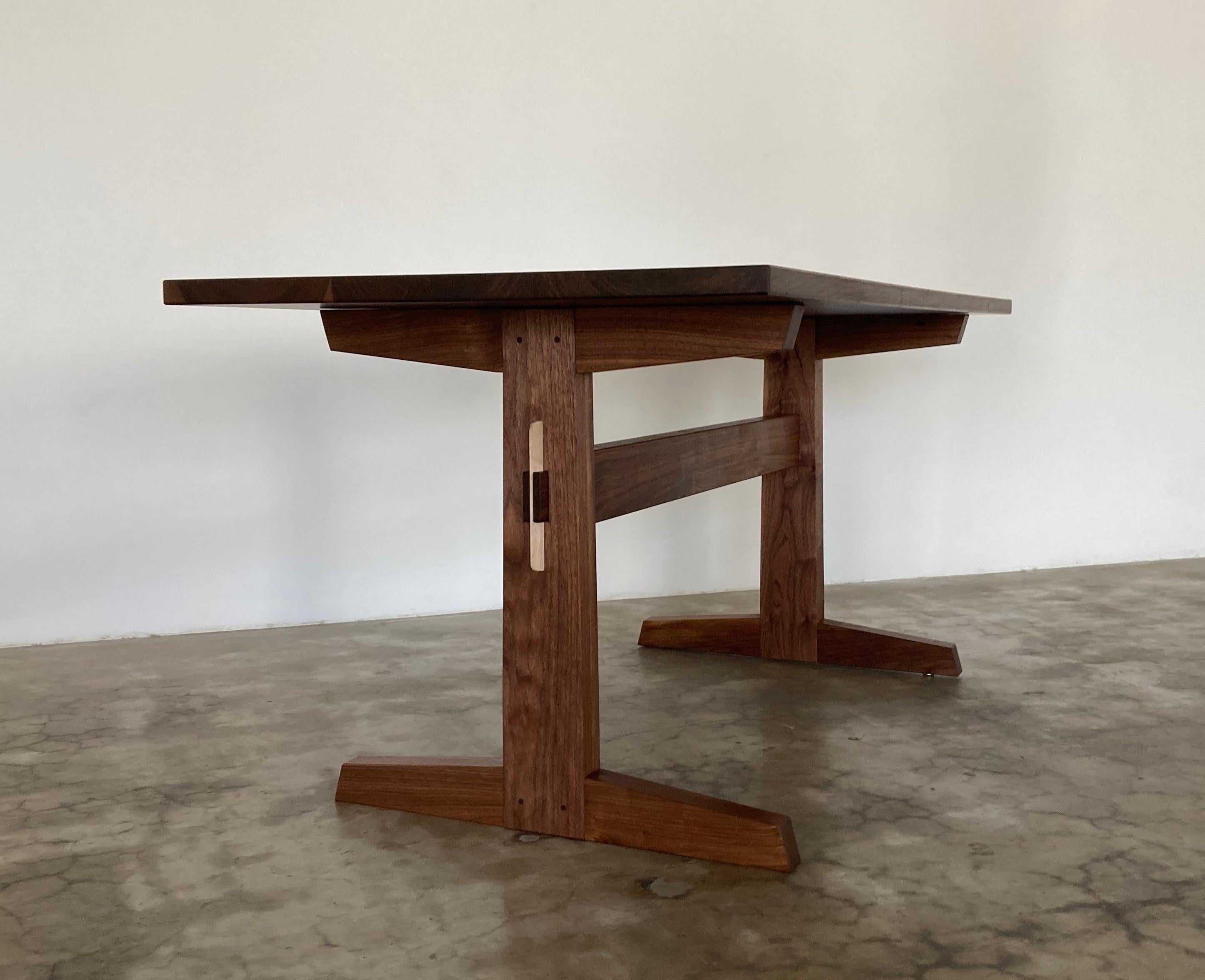 https://a.1stdibscdn.com/hana-walnut-trestle-dining-table-in-stock-for-sale-picture-6/f_49771/f_428426721734641627176/Hana_Trestle_San_Leandro_1_master.jpg