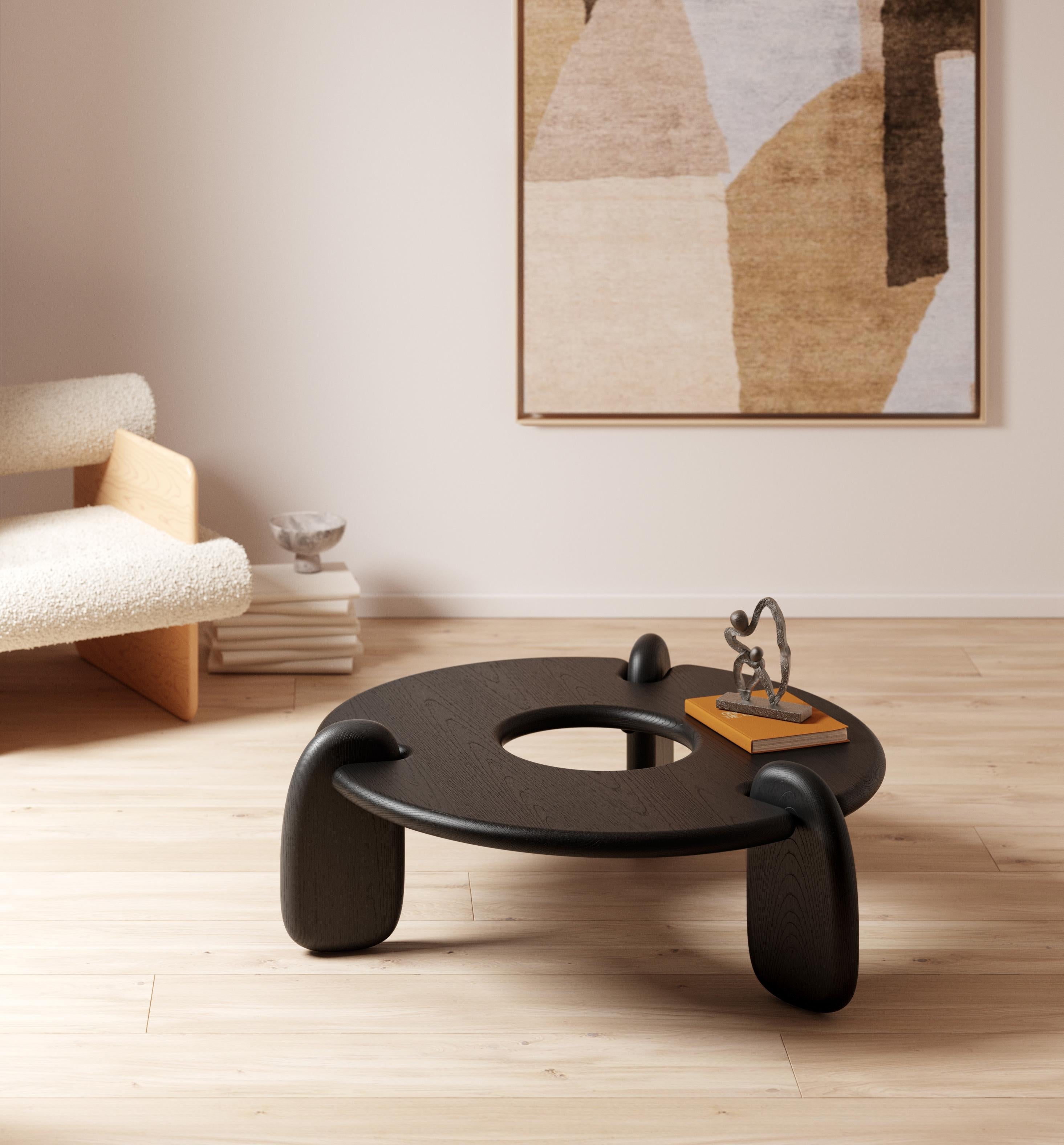 https://a.1stdibscdn.com/circular-48-inch-three-legged-ebonized-ash-henge-coffee-table-by-objects-ideas-for-sale-picture-2/f_37133/1624216891526/Henge_Coffee_Table_ash_R1B_master.jpg
