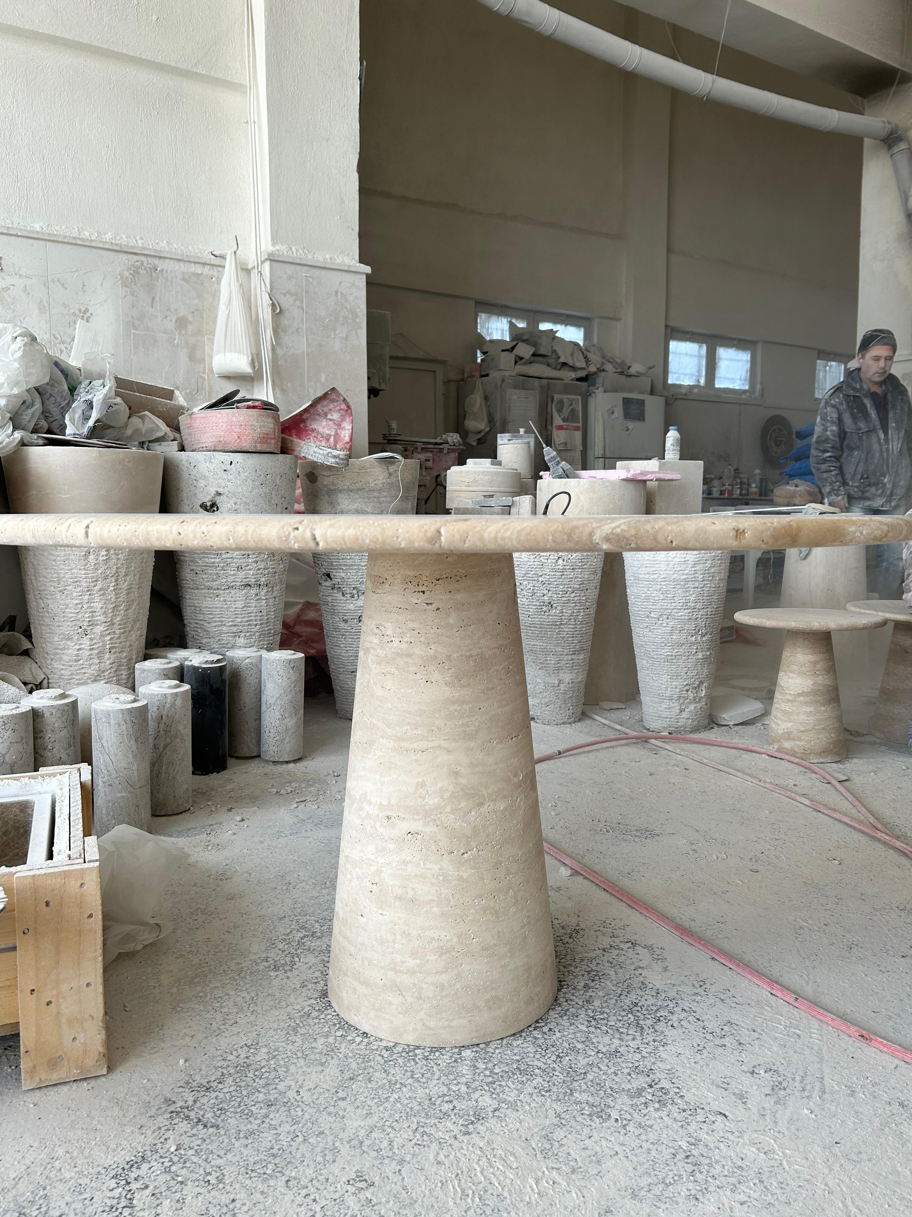https://a.1stdibscdn.com/cream-travertine-round-dining-table-in-the-style-of-1970-angelo-mangiarotti-for-sale-picture-2/f_80522/f_326691821675875056829/IMG_1675872872325_master.JPEG
