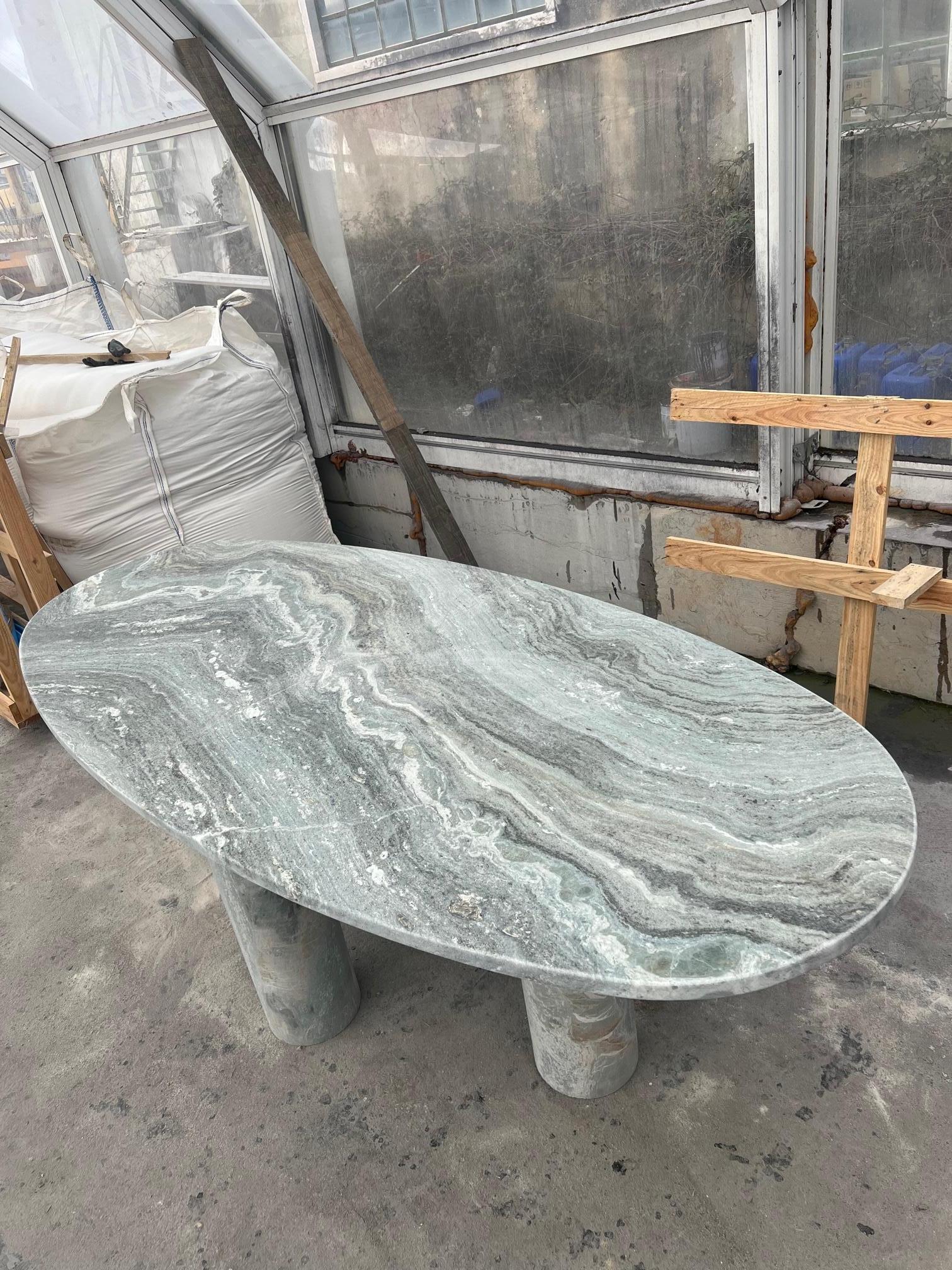 https://a.1stdibscdn.com/large-solid-stone-green-marble-oval-dining-table-with-column-legs-for-sale-picture-4/f_80522/f_32423352/IMG_1675951403045_master.jpg