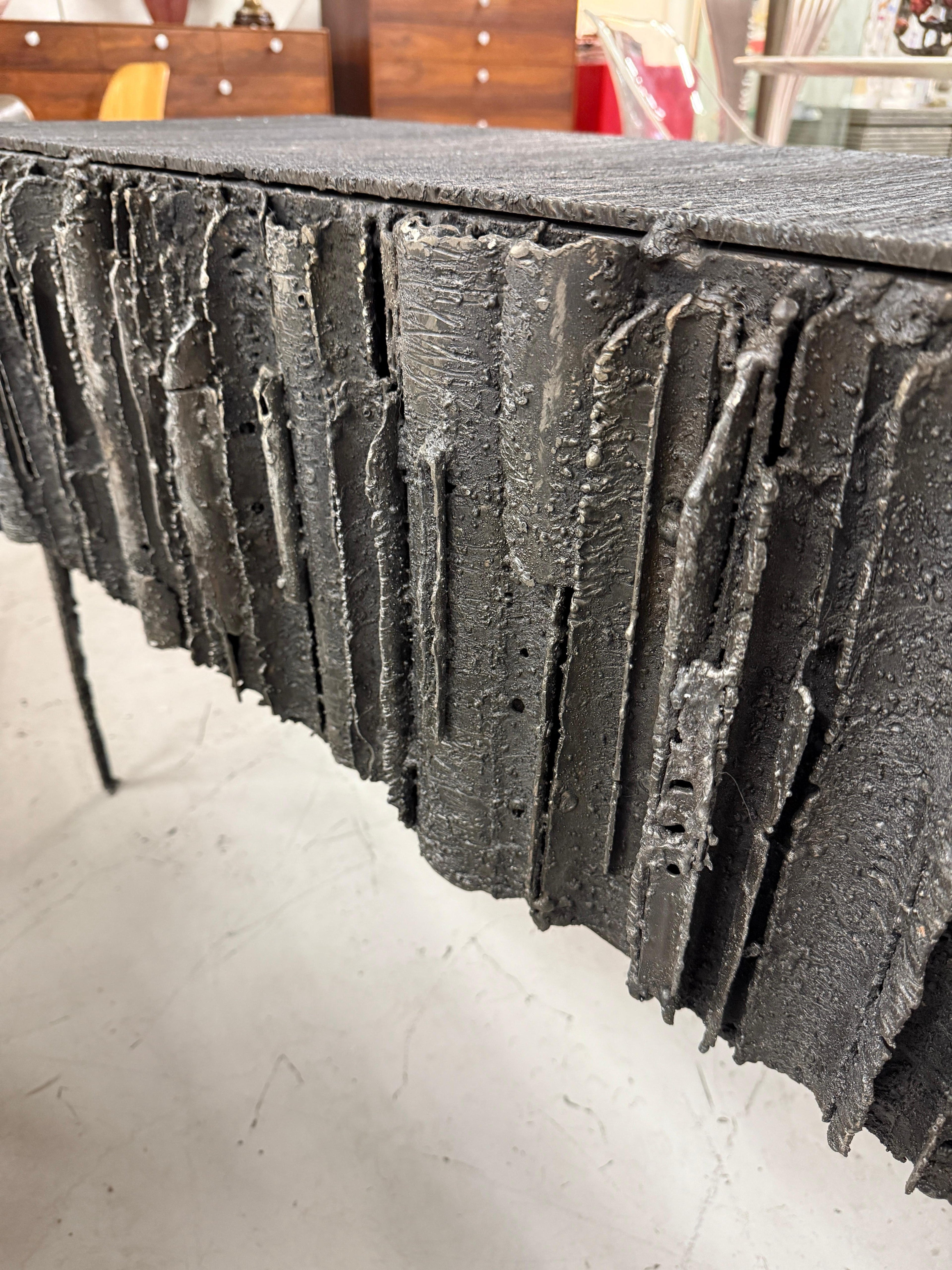 https://a.1stdibscdn.com/2021-james-bearden-brutalist-corinthian-cabinet-in-plasma-carved-steel-for-sale-picture-10/f_8350/f_46472972/IMG_1756588880264_master.jpeg