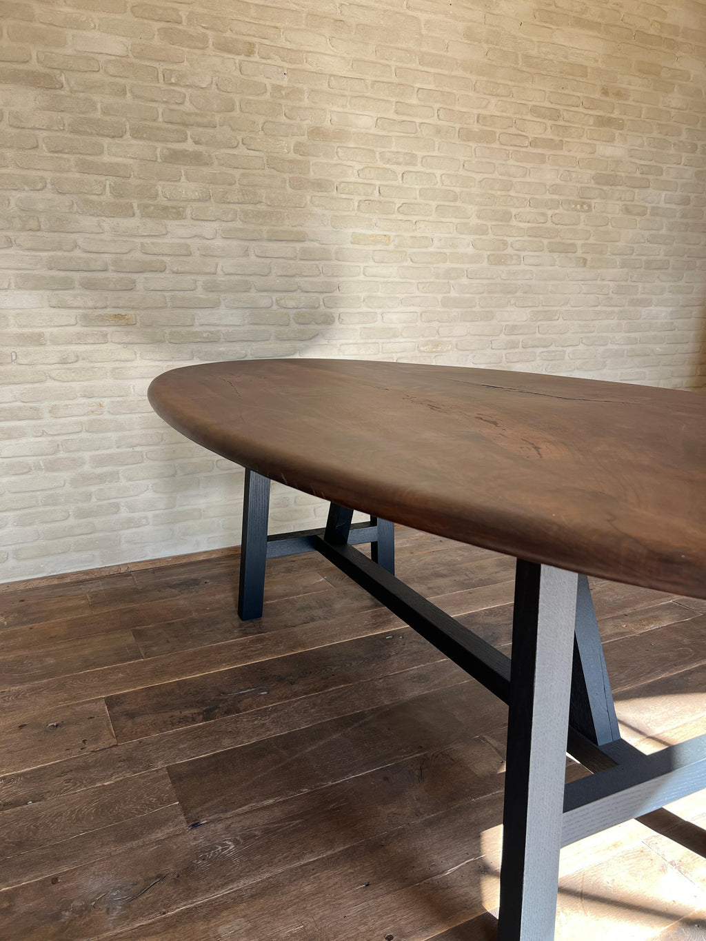 https://a.1stdibscdn.com/custom-walnut-2-plank-top-oval-dining-table-model-lusi-dark-finish-for-sale-picture-5/f_20233/f_47011632/IMG_1760212978944_master.JPG