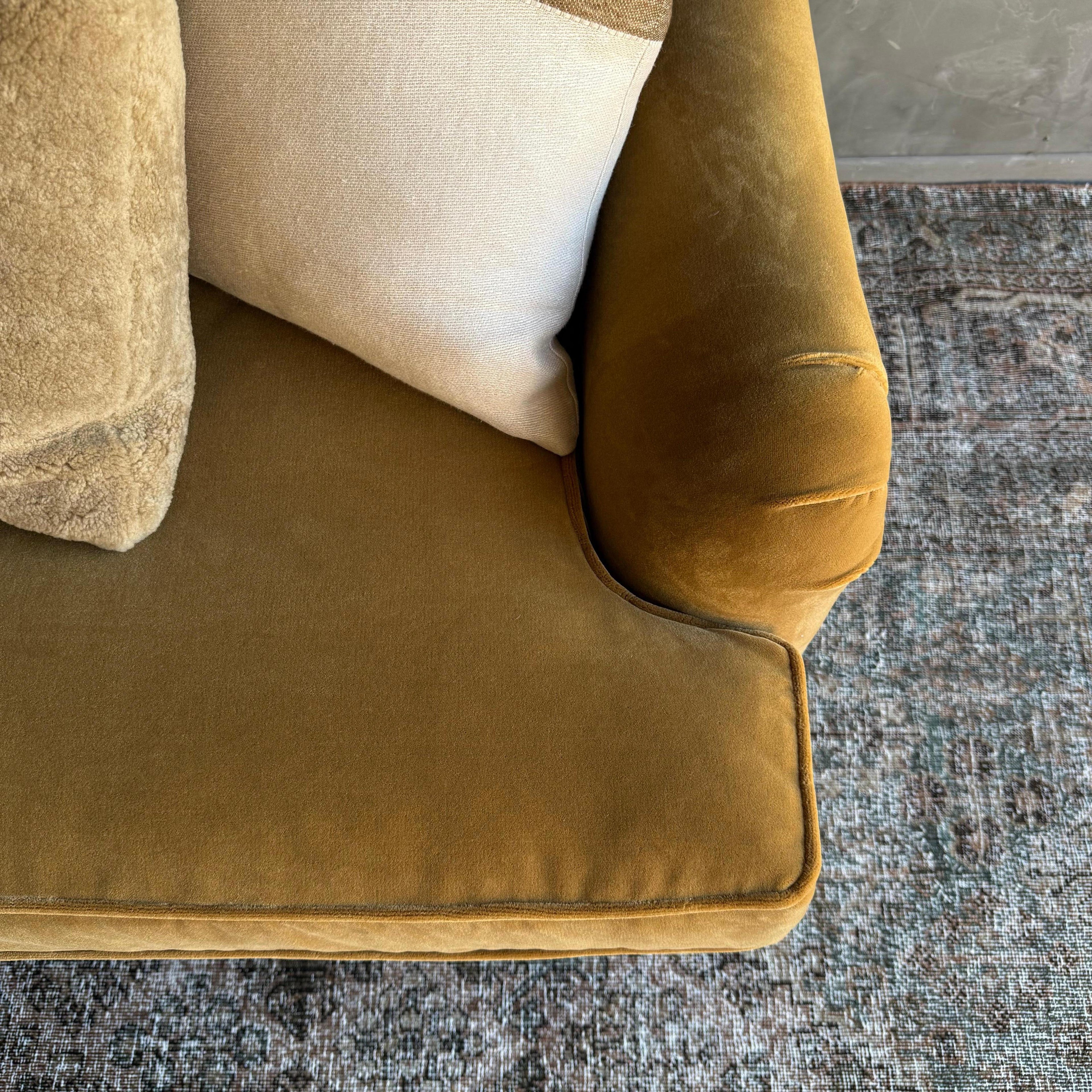 https://a.1stdibscdn.com/modern-english-sofa-in-a-caramel-mustard-faux-velvet-mohair-with-down-cushion-for-sale-picture-4/f_18223/f_47826952/IMG_2051_1764806024684_master.jpg