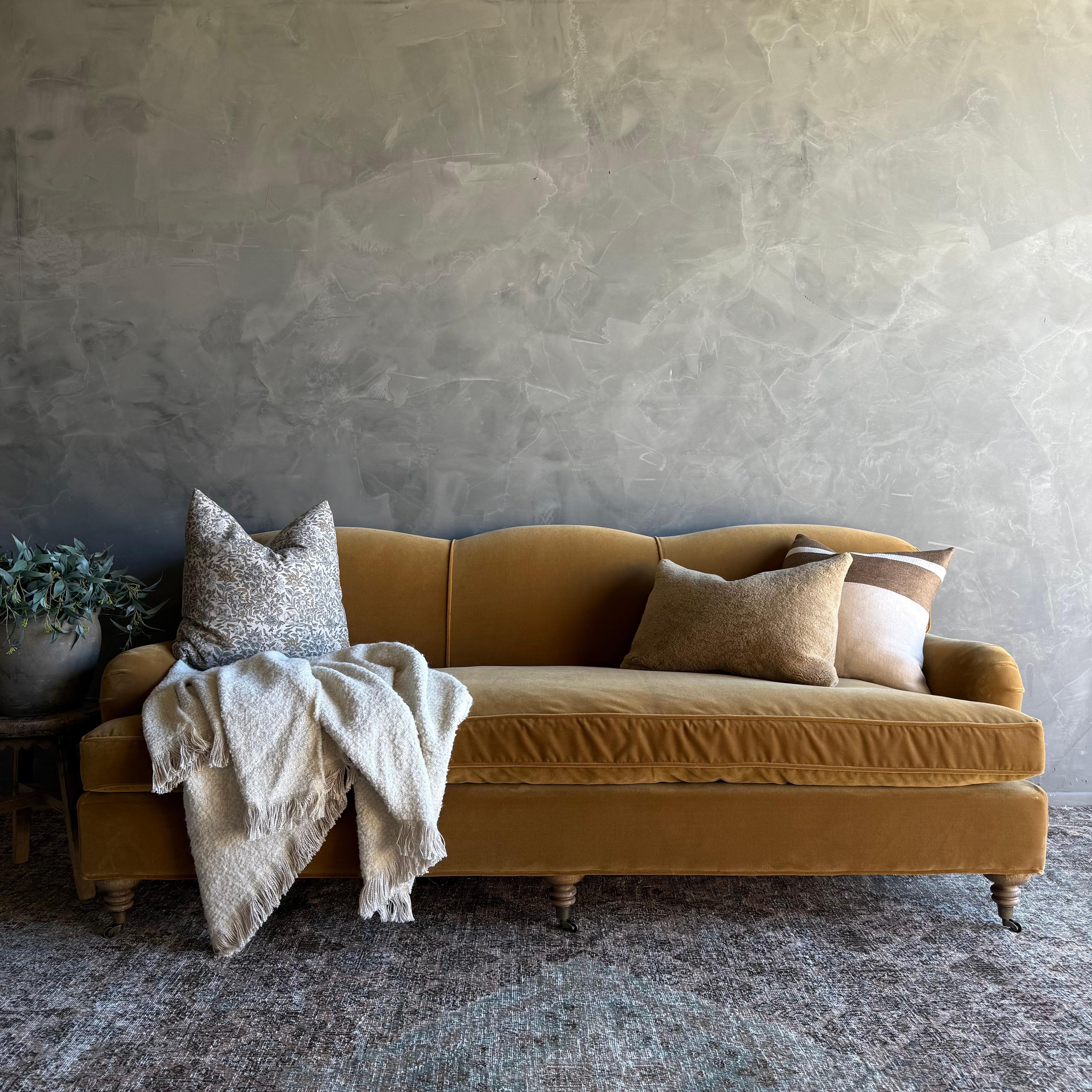 https://a.1stdibscdn.com/modern-english-sofa-in-a-caramel-mustard-faux-velvet-mohair-with-down-cushion-for-sale-picture-6/f_18223/f_478269521764805993470/IMG_2054_2_master.jpg
